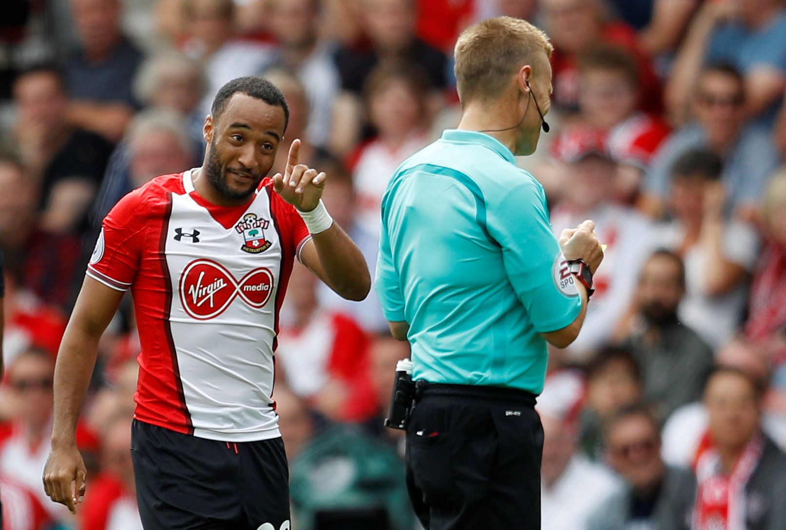 Football Soccer - Premier League - Southampton vs Swansea City - Southampton, Britain - August 12, 2017   Southampton's Nathan Redmond is shown a yellow card by referee Mike Jones   REUTERS/Peter Nicholls  EDITORIAL USE ONLY. No use with unauthorized audio, video, data, fixture lists, club/league logos or 