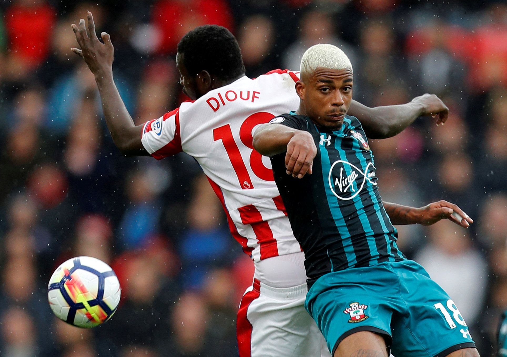Soccer Football - Premier League - Stoke City vs Southampton - bet365 Stadium, Stoke, Britain - September 30, 2017  Stoke City's Mame Biram Diouf in action with Southampton's Mario Lemina    REUTERS/Darren Staples  EDITORIAL USE ONLY. No use with unauthorized audio, video, data, fixture lists, club/league logos or 