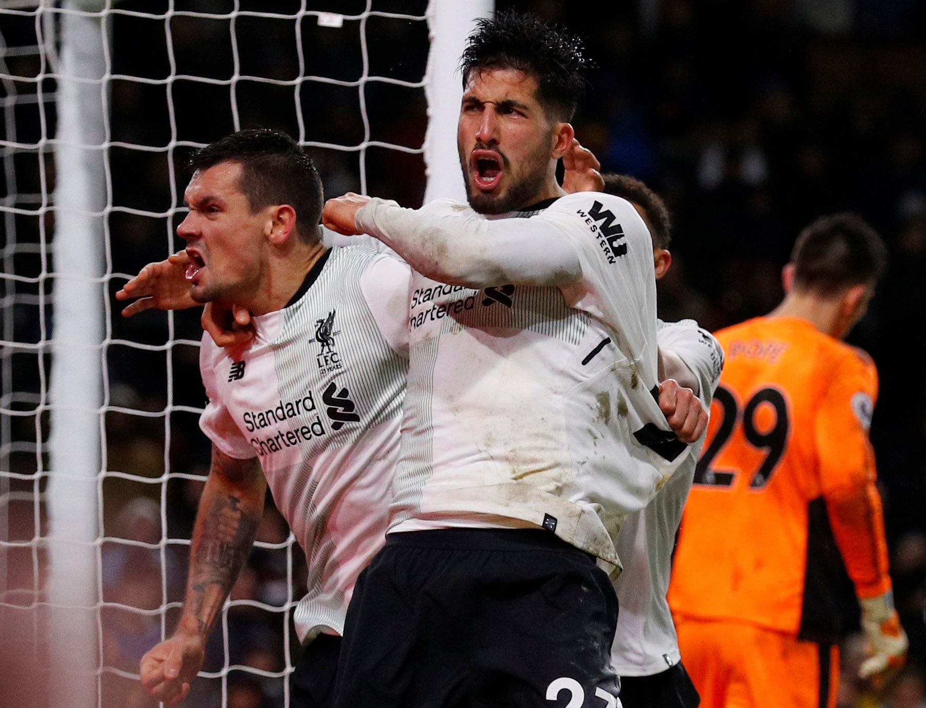 Soccer Football - Premier League - Burnley vs Liverpool - Turf Moor, Burnley, Britain - January 1, 2018   Liverpool's Dejan Lovren and Emre Can celebrates after Ragnar Klavan scored their second goal        REUTERS/Phil Noble    EDITORIAL USE ONLY. No use with unauthorized audio, video, data, fixture lists, club/league logos or 