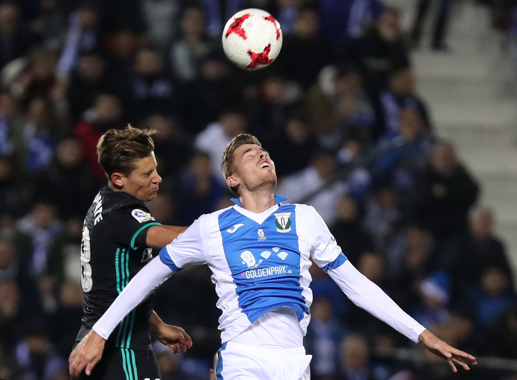Soccer Football - Spanish King's Cup - Leganes vs Real Madrid - Quarter-Final - First Leg - Butarque Municipal Stadium, Leganes, Spain - January 18, 2018   Real Madrid’s Marcos Llorente in action with Leganes’ Gerard Gumbau     REUTERS/Susana Vera