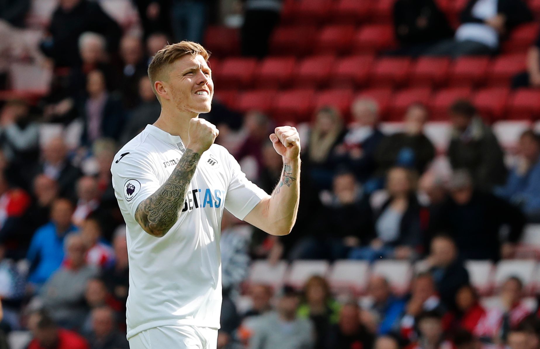 Britain Football Soccer - Sunderland v Swansea City - Premier League - Stadium of Light - 13/5/17 Swansea City's Alfie Mawson celebrates after the match  Reuters / Russell Cheyne Livepic EDITORIAL USE ONLY. No use with unauthorized audio, video, data, fixture lists, club/league logos or "live" services. Online in-match use limited to 45 images, no video emulation. No use in betting, games or single club/league/player publications.  Please contact your account representative for further details.