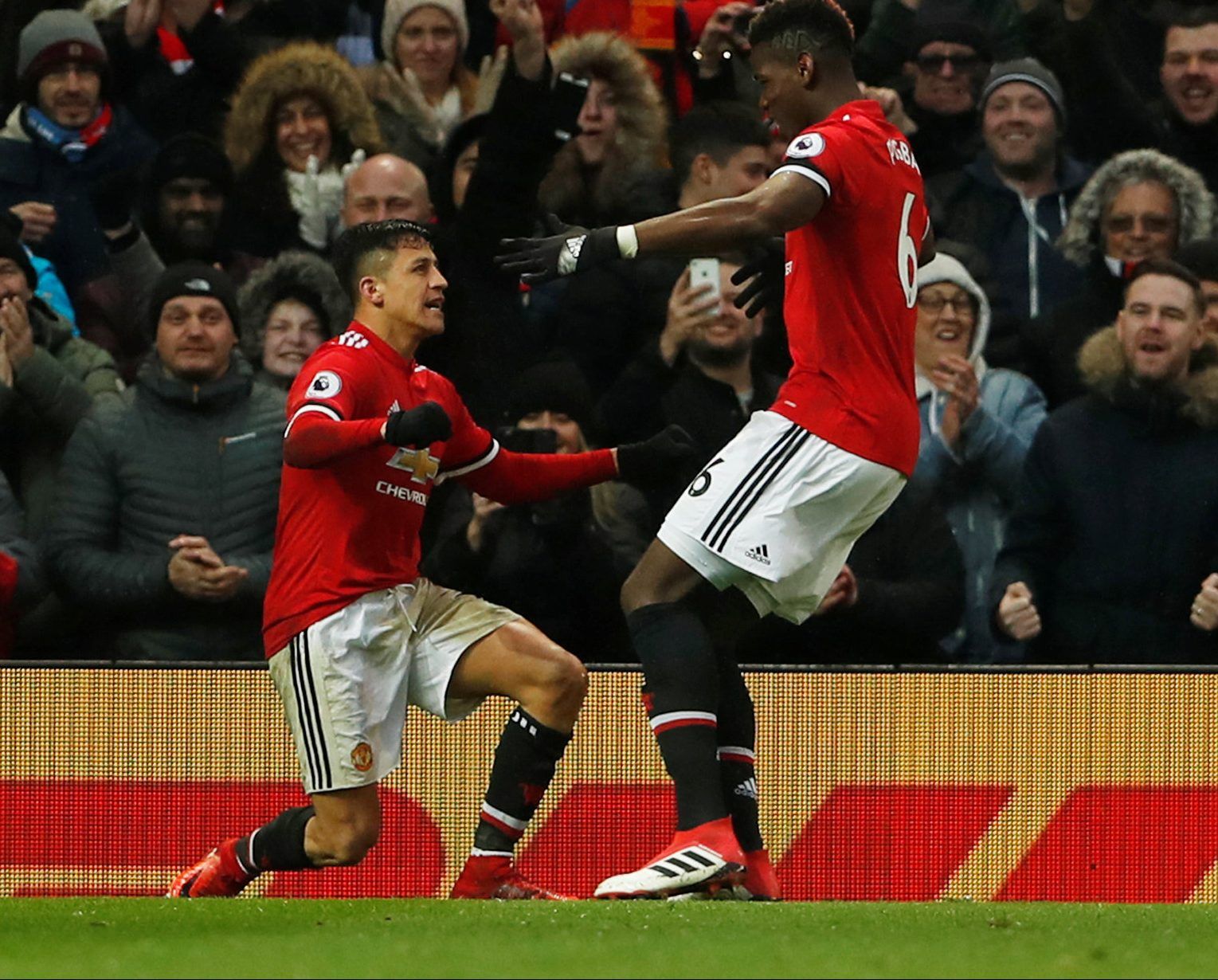 Soccer Football - Premier League - Manchester United vs Huddersfield Town - Old Trafford, Manchester, Britain - February 3, 2018   Manchester United’s Alexis Sanchez celebrates scoring their second goal with Paul Pogba    Action Images via Reuters/Lee Smith    EDITORIAL USE ONLY. No use with unauthorized audio, video, data, fixture lists, club/league logos or 