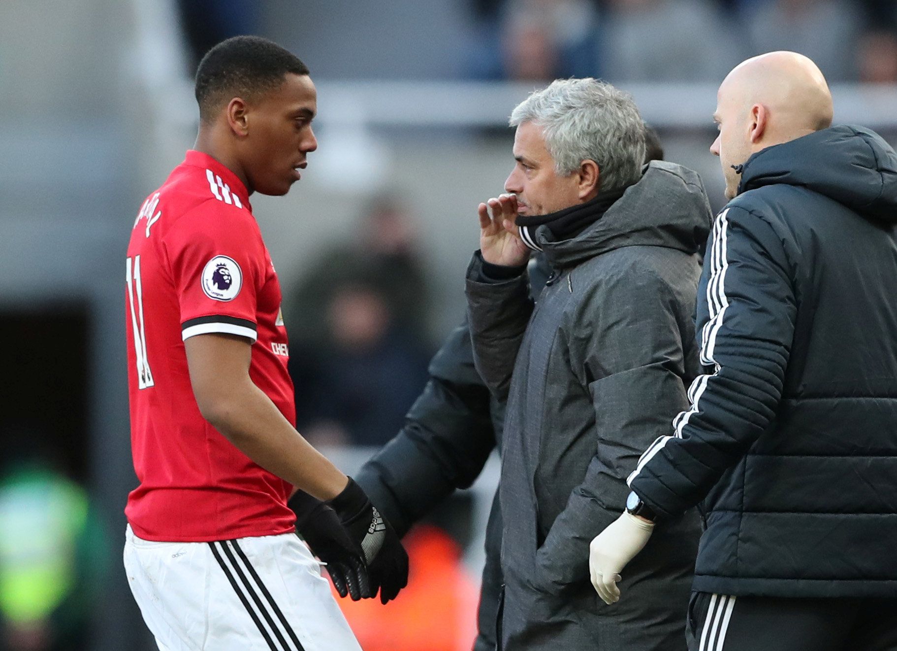 Soccer Football - Premier League - Newcastle United vs Manchester United - St James' Park, Newcastle, Britain - February 11, 2018   Manchester United manager Jose Mourinho talks to Anthony Martial as he comes off the pitch for receiving medical treatment   REUTERS/Scott Heppell    EDITORIAL USE ONLY. No use with unauthorized audio, video, data, fixture lists, club/league logos or 