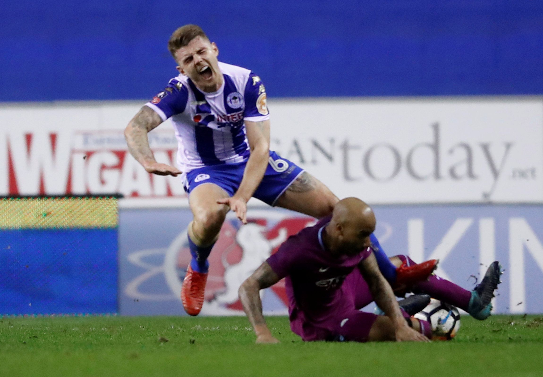 Soccer Football - FA Cup Fifth Round - Wigan Athletic vs Manchester City - DW Stadium, Wigan, Britain - February 19, 2018   Manchester City's Fabian Delph fouls Wigan Athletic’s Max Power and was subsequently shown a red card   Action Images via Reuters/Carl Recine