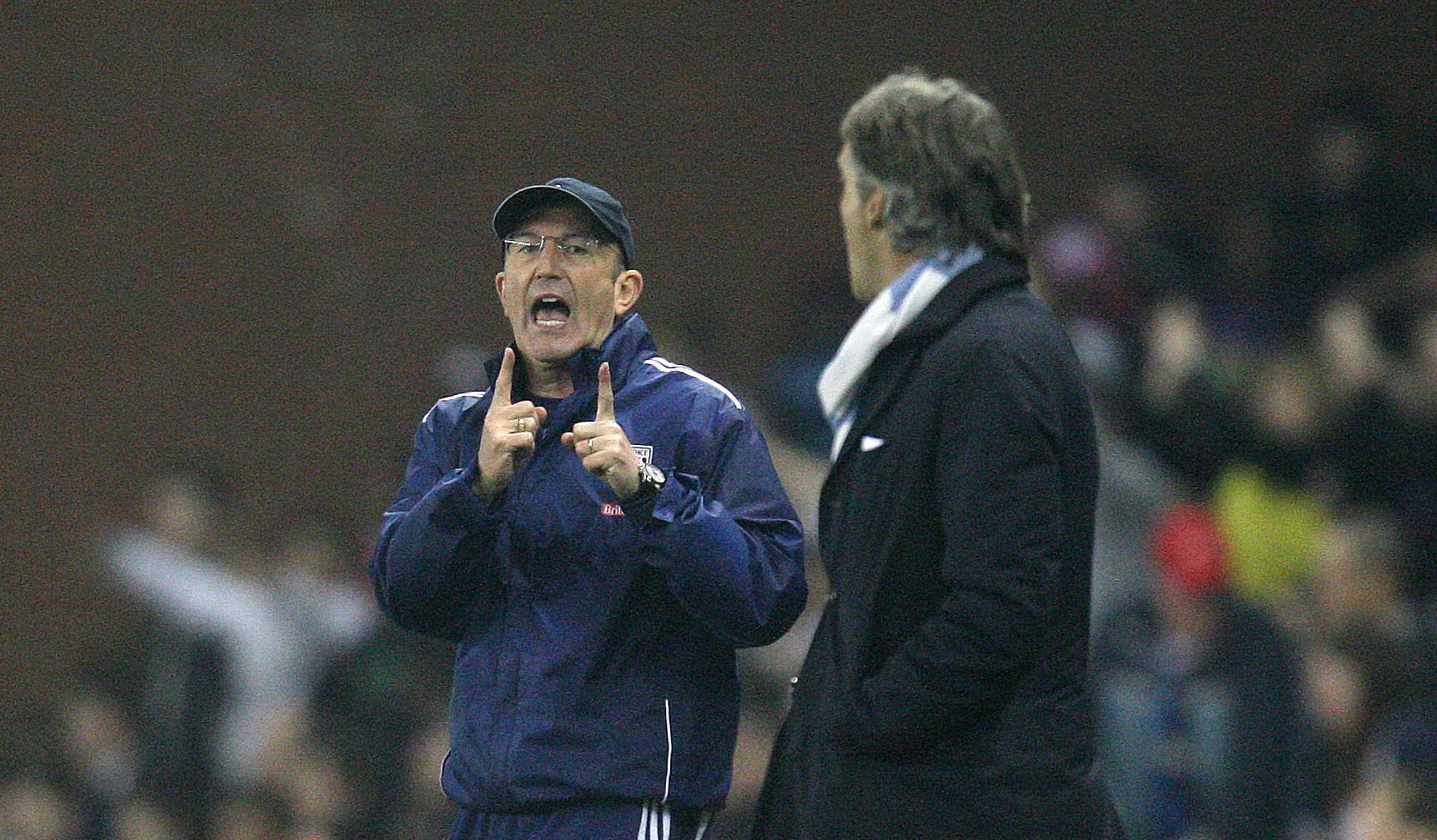 Football - Stoke City v Manchester City Barclays Premier League  - The Britannia Stadium - 24/3/12 
Manchester City manager Roberto Mancini and Stoke manager Tony Pulis (L) clash on the touchline 
Mandatory Credit: Action Images / Carl Recine 
Livepic 
EDITORIAL USE ONLY. No use with unauthorized audio, video, data, fixture lists, club/league logos or live services. Online in-match use limited to 45 images, no video emulation. No use in betting, games or single club/league/player publications.  