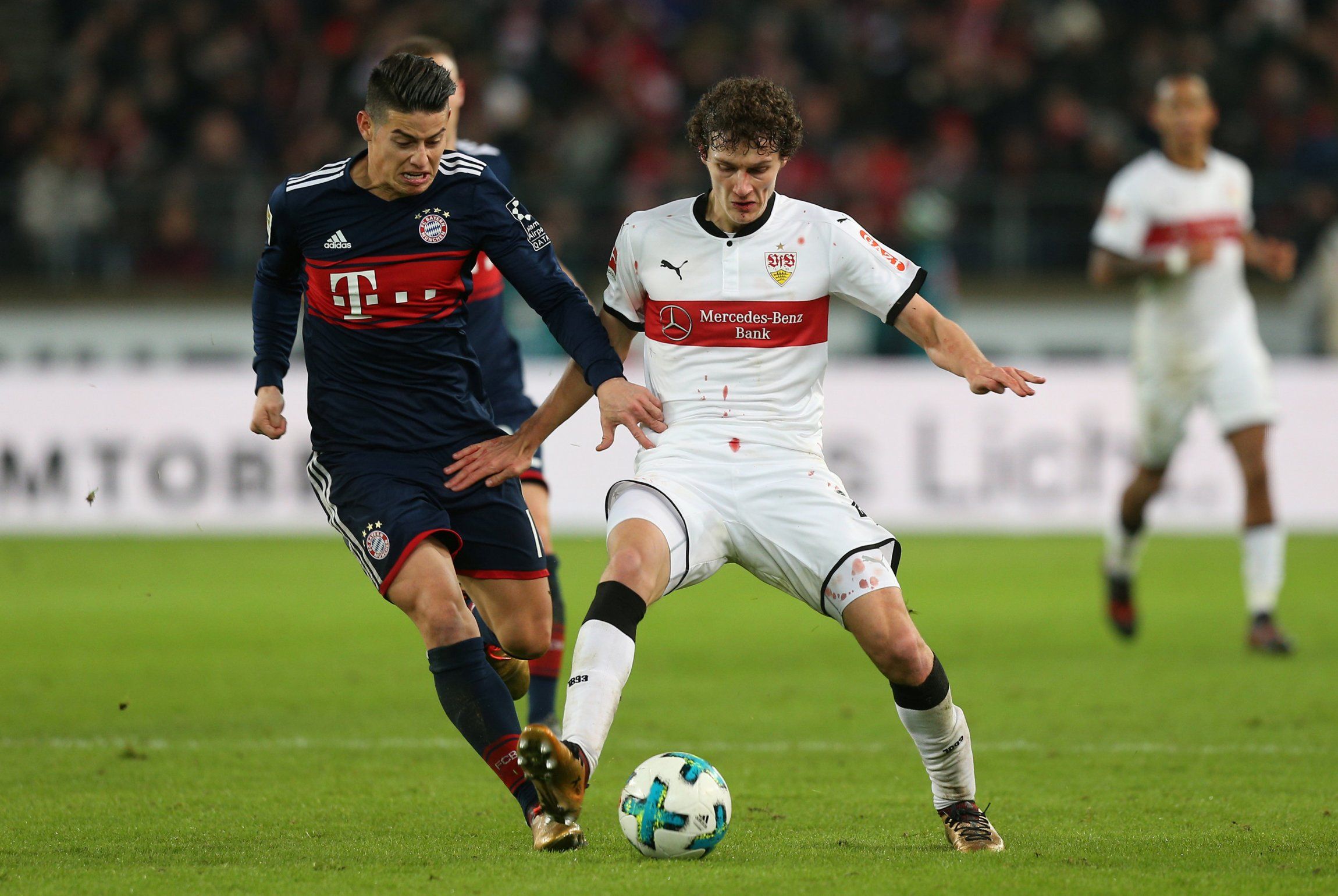 Benjamin Pavard in action with Bayern Munich's James Rodriguez