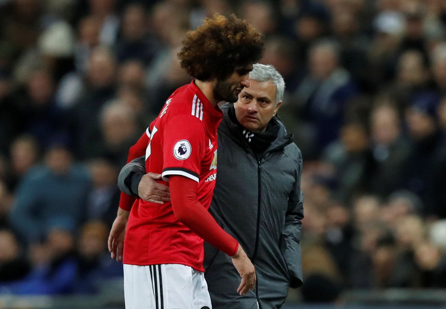 Soccer Football - Premier League - Tottenham Hotspur vs Manchester United - Wembley Stadium, London, Britain - January 31, 2018   Manchester United's Marouane Fellaini gets a hug from manager Jose Mourinho as he is substituted shortly after coming on    REUTERS/Eddie Keogh    EDITORIAL USE ONLY. No use with unauthorized audio, video, data, fixture lists, club/league logos or 