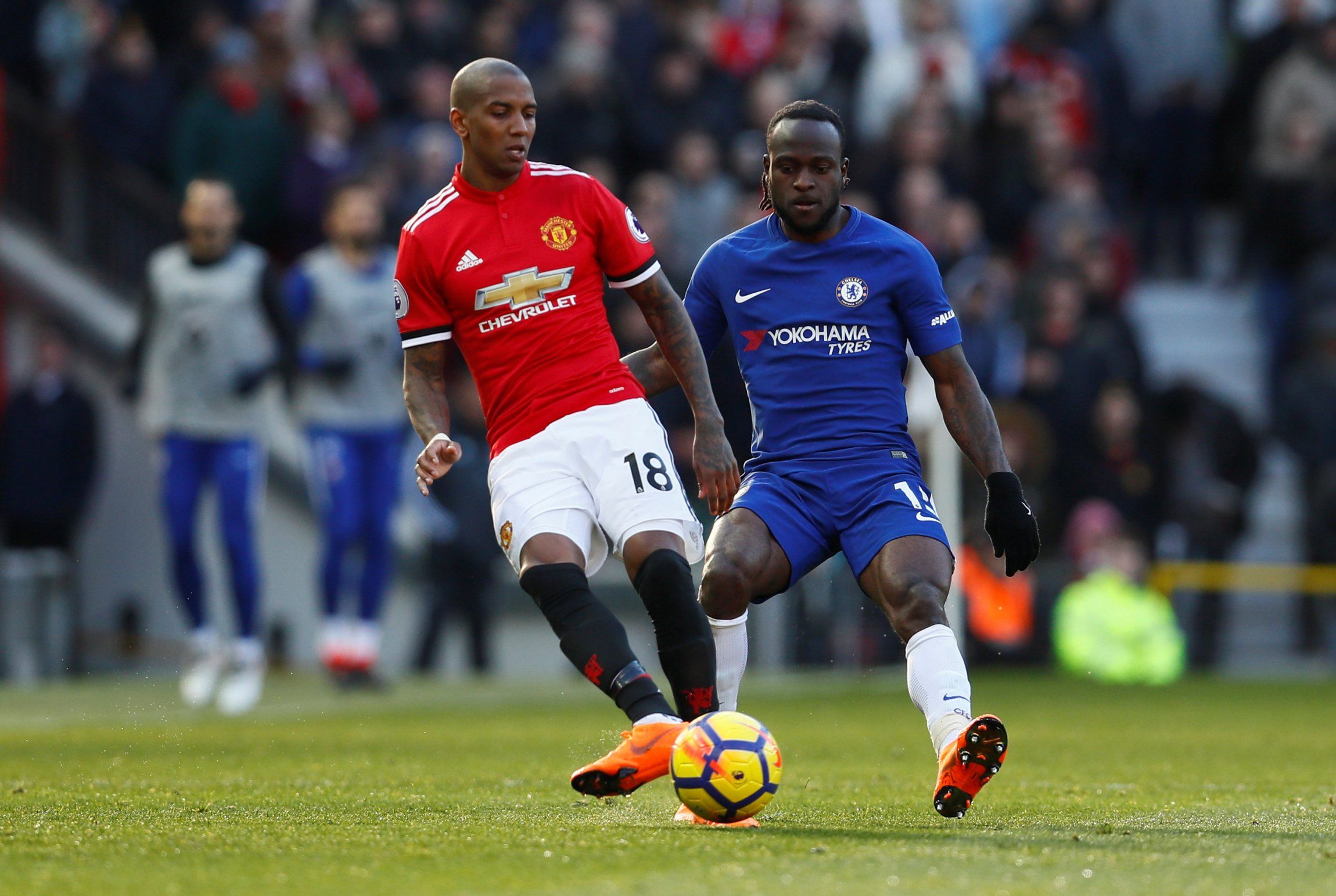 Ashley Young evades Victor Moses