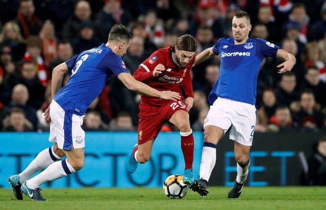 Soccer Football - FA Cup Third Round - Liverpool vs Everton - Anfield, Liverpool, Britain - January 5, 2018   Liverpool's Adam Lallana in action with Everton's Phil Jagielka and Morgan Schneiderlin    Action Images via Reuters/Carl Recine