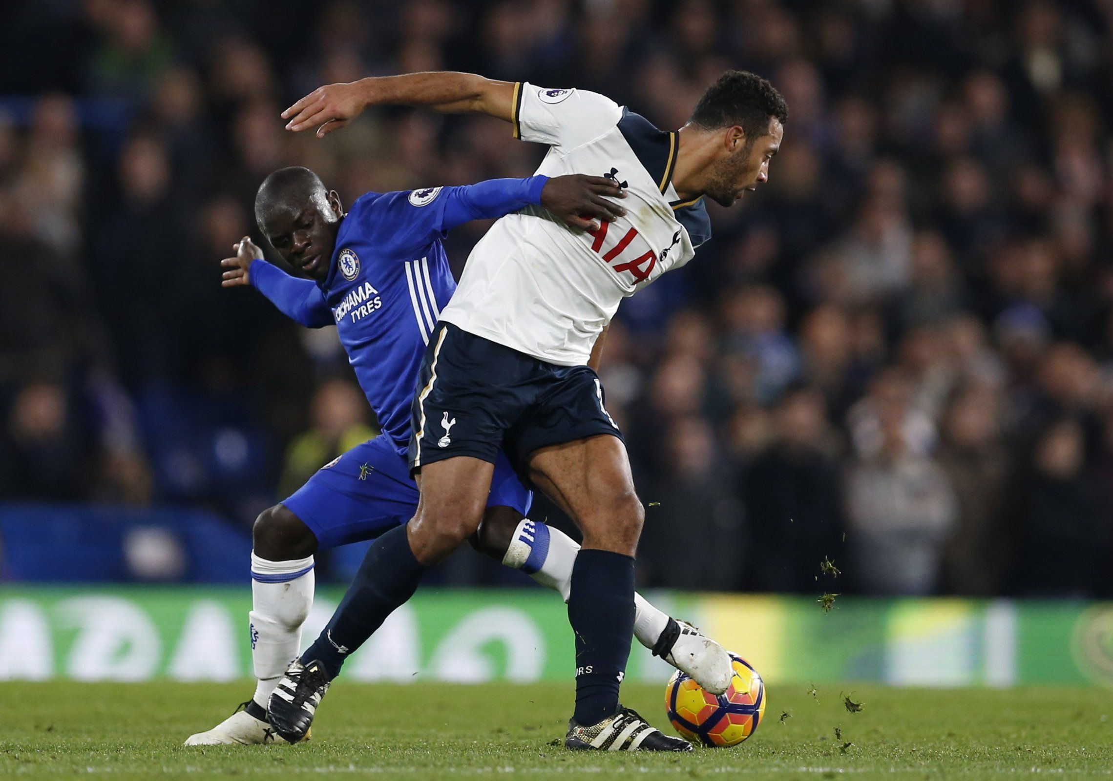 Mousa Dembele and N'Golo Kante wrestle for the ball