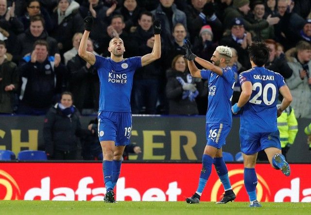 Soccer Football - Premier League - Leicester City vs Huddersfield Town - King Power Stadium, Leicester, Britain - January 1, 2018   Leicester City's Islam Slimani celebrates scoring their second goal with team mates            REUTERS/Darren Staples    EDITORIAL USE ONLY. No use with unauthorized audio, video, data, fixture lists, club/league logos or 