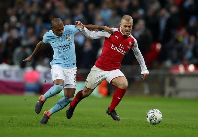 Soccer Football - Carabao Cup Final - Arsenal vs Manchester City - Wembley Stadium, London, Britain - February 25, 2018   Manchester City's Fernandinho in action with Arsenal's Jack Wilshere    Action Images via Reuters/Peter Cziborra     EDITORIAL USE ONLY. No use with unauthorized audio, video, data, fixture lists, club/league logos or 
