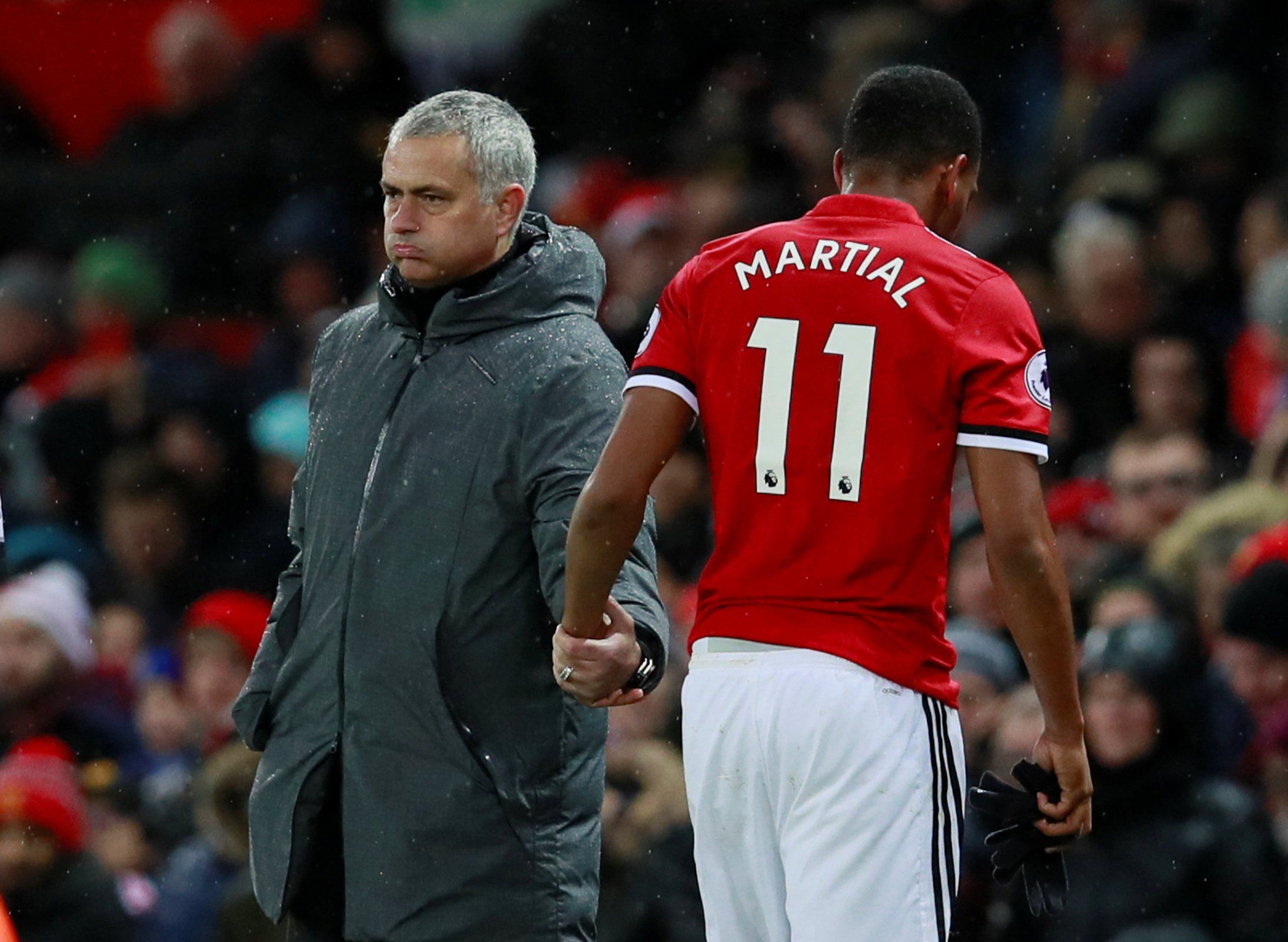 Manchester United manager Jose Mourinho shakes hands with Anthony Martial after he's substituted against Brighton