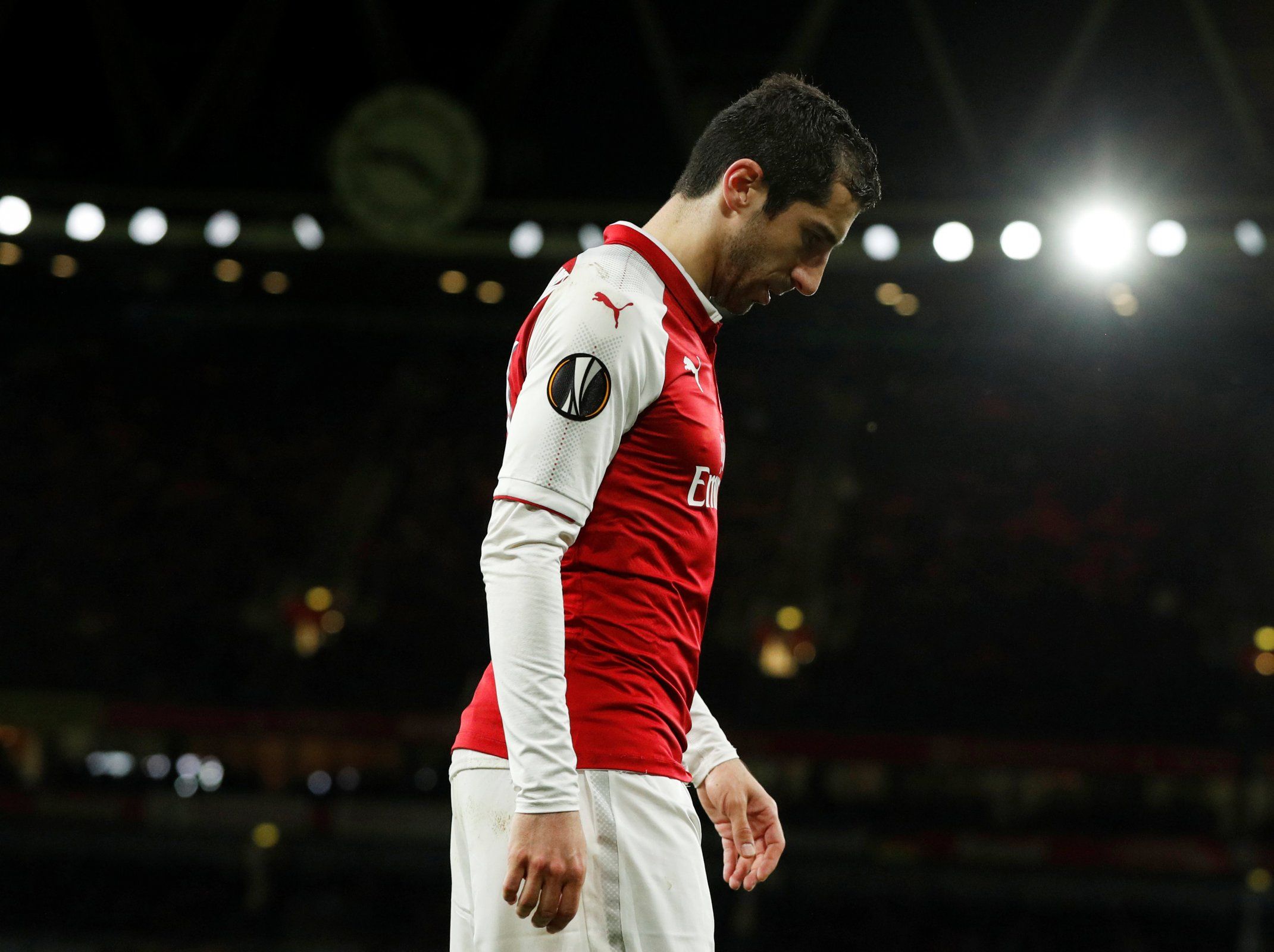 Henrikh Mkhitaryan leaves the pitch injured during Arsenal's clash against CSKA Moscow