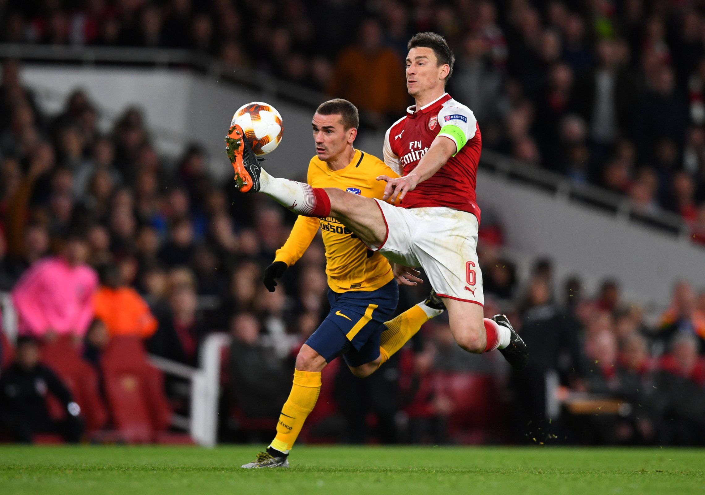 Laurent Koscielny closed down by Antoine Griezmann in Arsenal's Europa League semi-final against Atletico Madrid