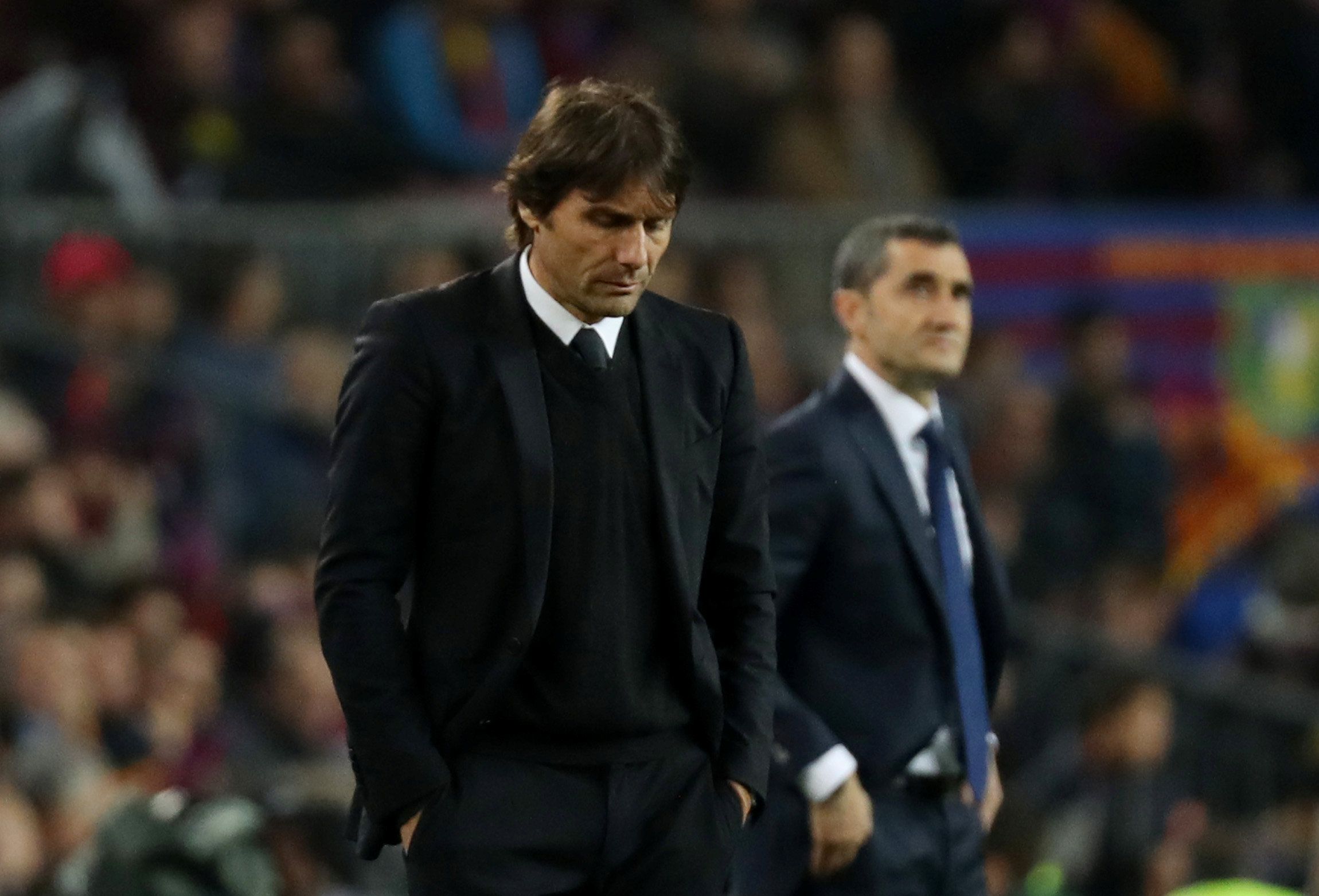 Antonio Conte looks dejected at the Nou Camp
