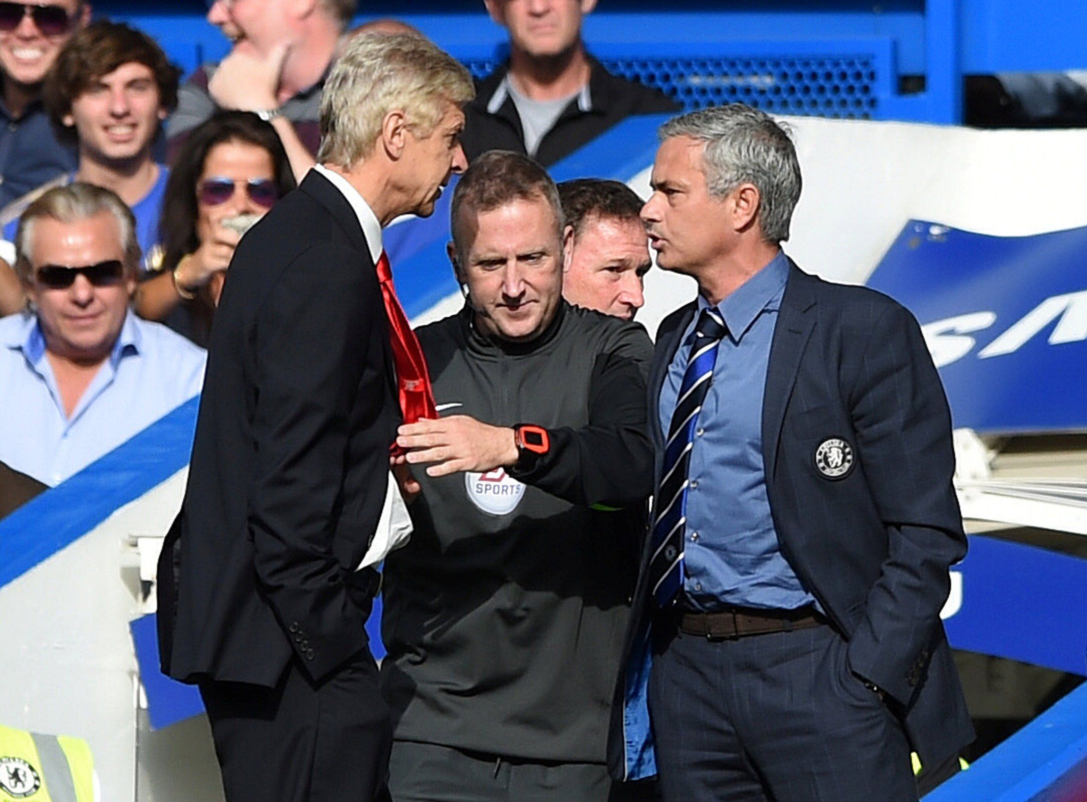 Arsene Wenger and Jose Mourinho shove each other on the touchline