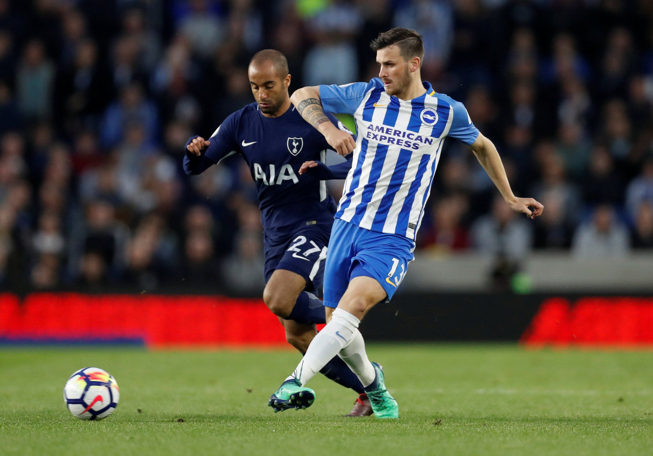 Brighton star Pascal Gross in action with Lucas Moura