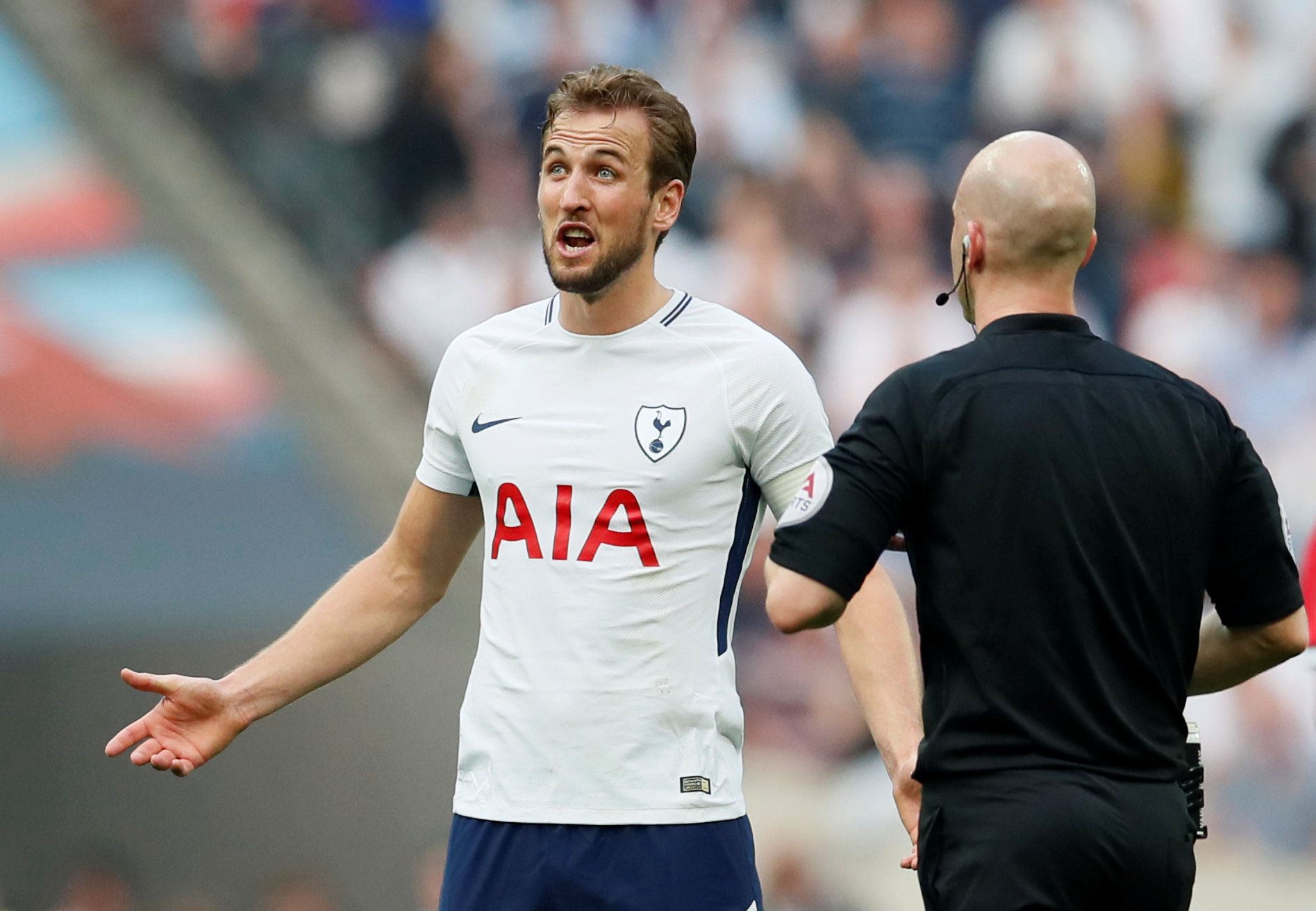 Harry Kane argues with referee Anthony Taylor