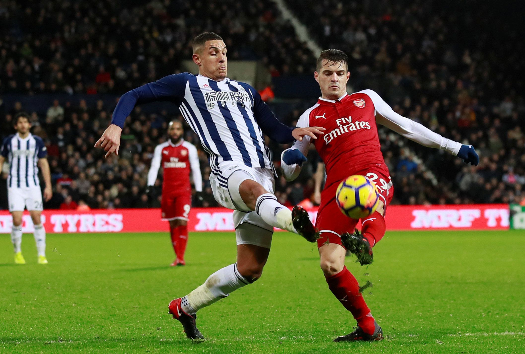 Soccer Football - Premier League - West Bromwich Albion vs Arsenal - The Hawthorns, West Bromwich, Britain - December 31, 2017   Arsenal's Granit Xhaka in action with West Bromwich Albion's Jake Livermore      Action Images via Reuters/Jason Cairnduff    EDITORIAL USE ONLY. No use with unauthorized audio, video, data, fixture lists, club/league logos or 