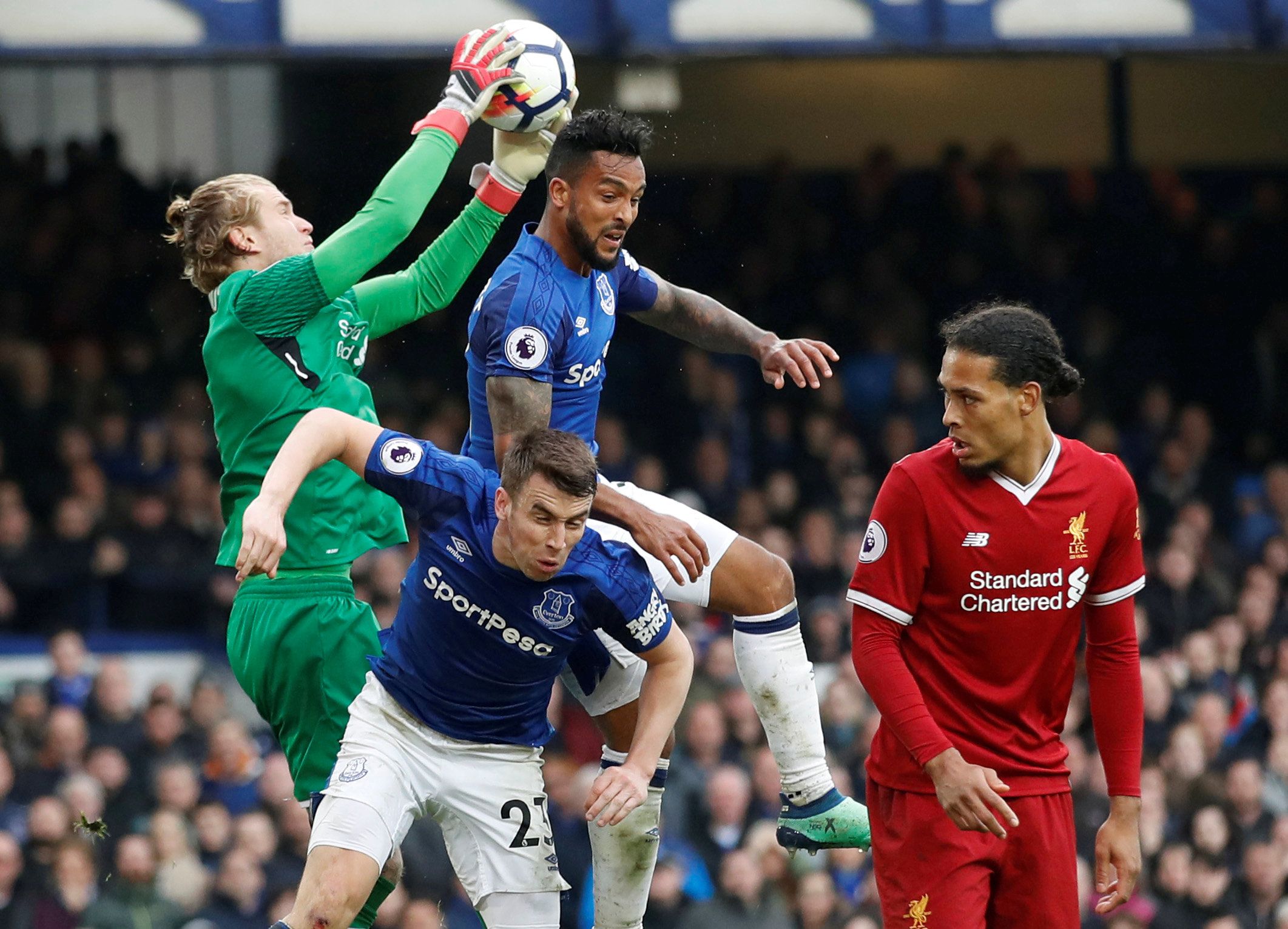 Soccer Football - Premier League - Everton vs Liverpool - Goodison Park, Liverpool, Britain - April 7, 2018   Liverpool's Loris Karius gathers from Everton's Theo Walcott and Seamus Coleman as Liverpool's Virgil van Dijk looks on   Action Images via Reuters/Carl Recine    EDITORIAL USE ONLY. No use with unauthorized audio, video, data, fixture lists, club/league logos or 