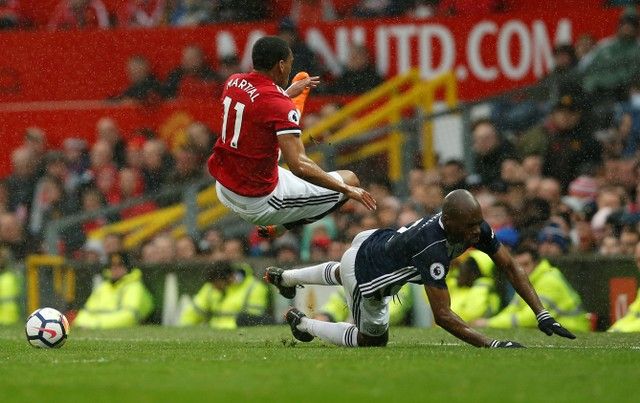 Soccer Football - Premier League - Manchester United vs West Bromwich Albion - Old Trafford, Manchester, Britain - April 15, 2018   West Bromwich Albion's Allan Nyom in action with Manchester United's Anthony Martial             REUTERS/Andrew Yates    EDITORIAL USE ONLY. No use with unauthorized audio, video, data, fixture lists, club/league logos or 