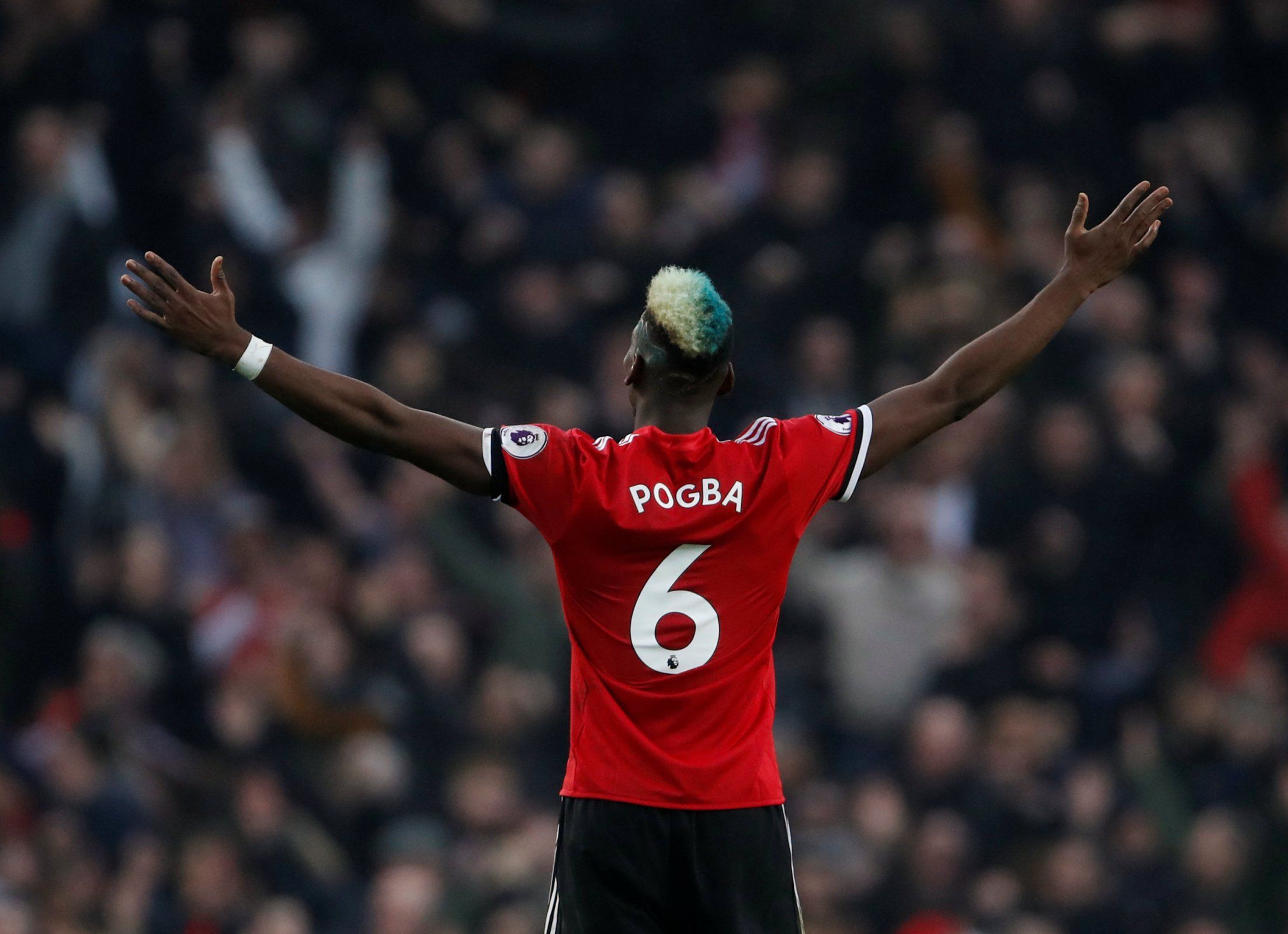 Paul Pogba celebrates winning against Manchester City