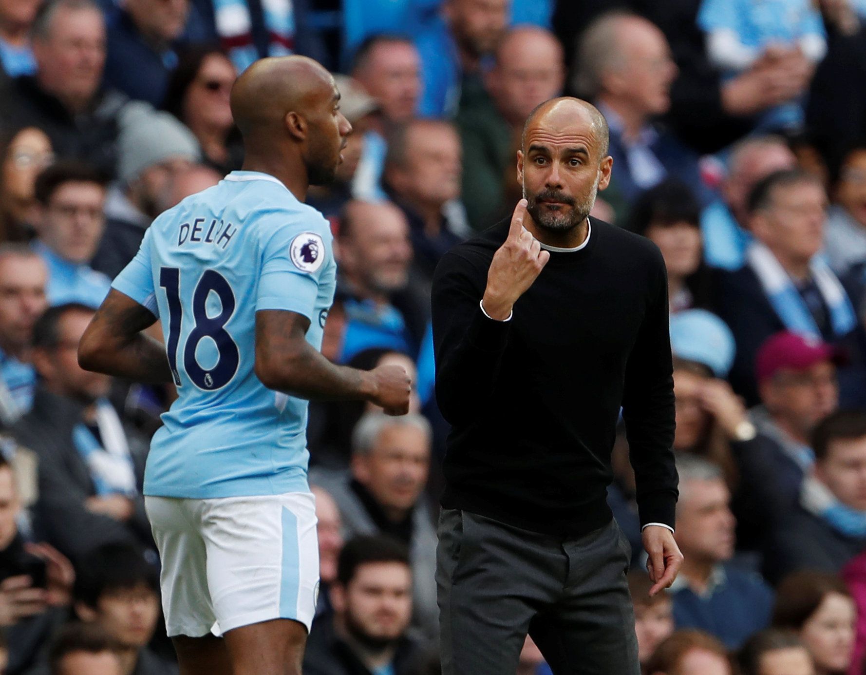 Pep Guardiola gives orders to Fabian Delph
