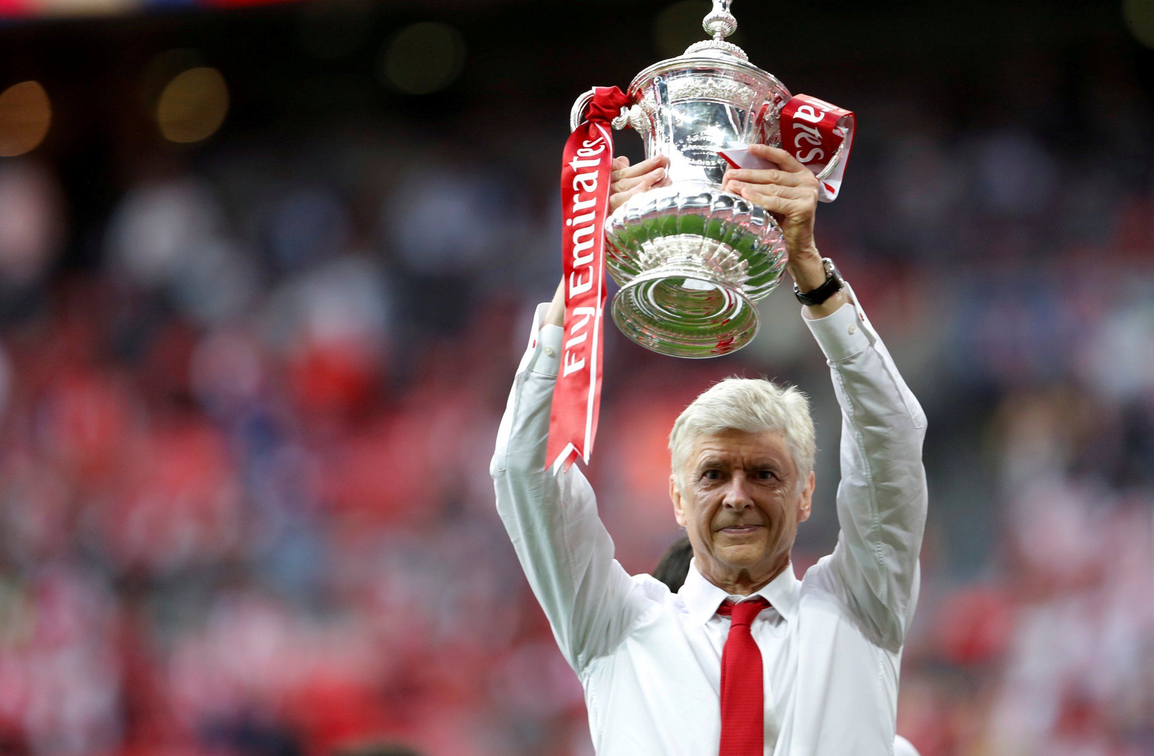 Arsene wenger lifts the fa cup for arsenal