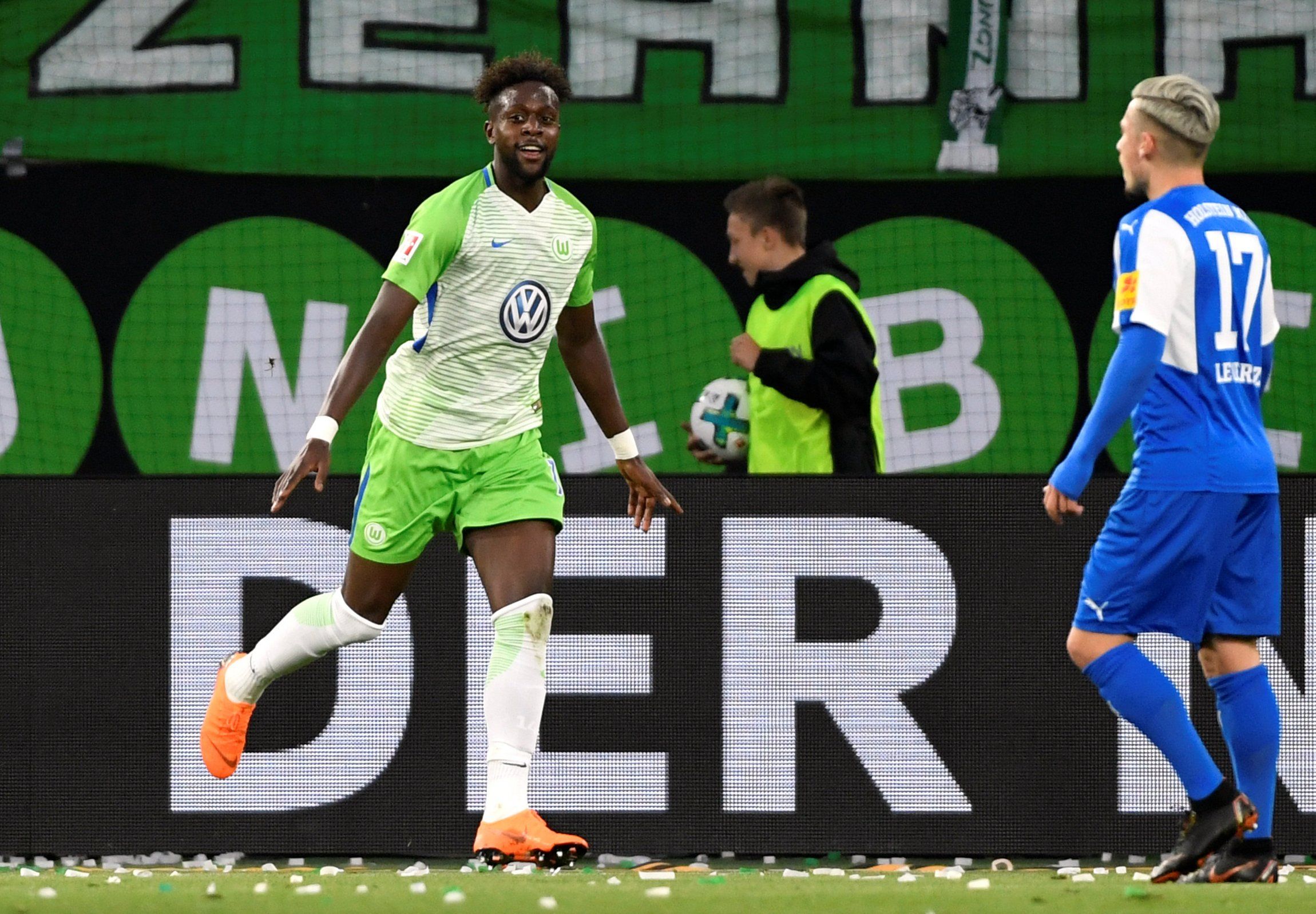 Divock Origi celebrates scoring for Wolfsburg in a playoff tie against Kiel