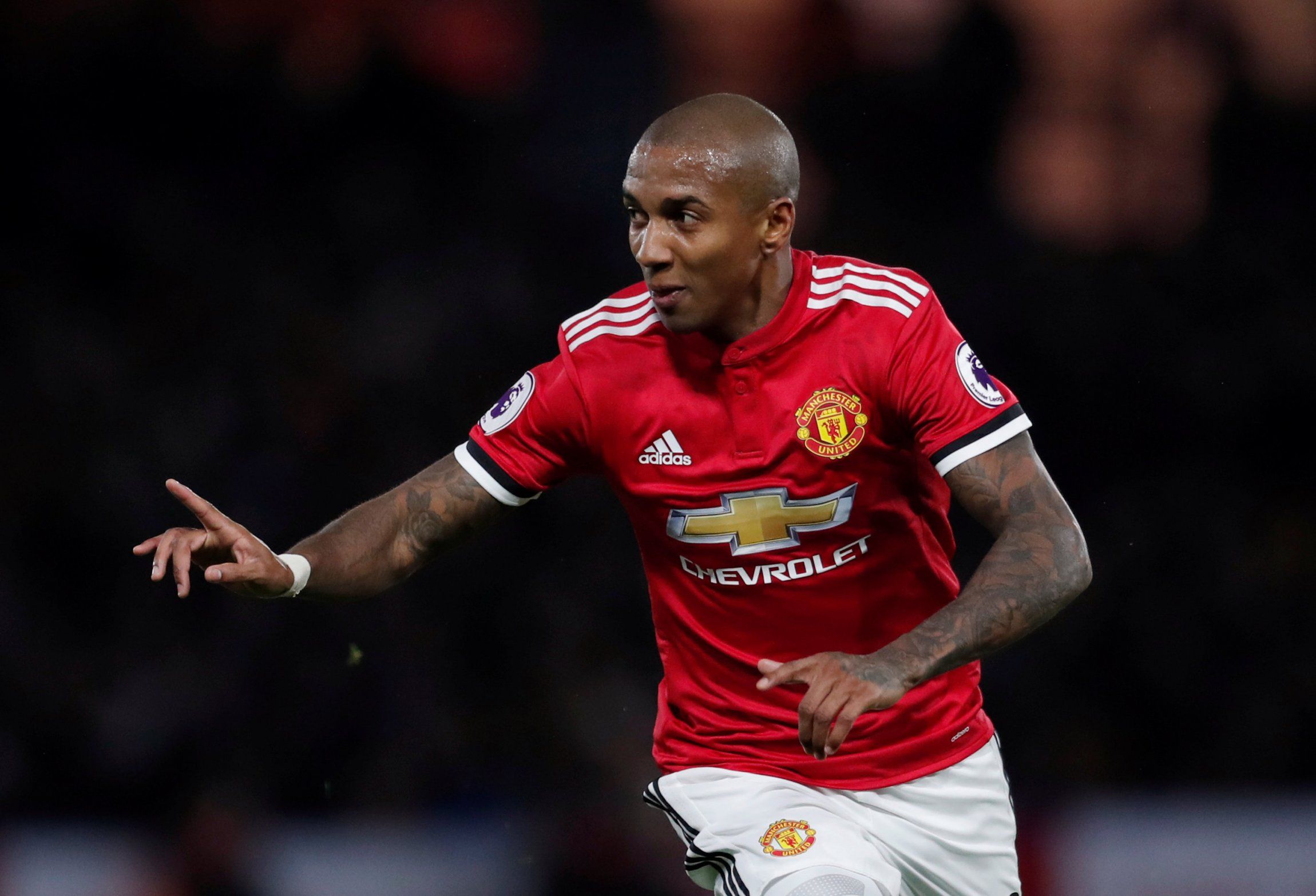 Ashley Young celebrates scoring a goal for Manchester United