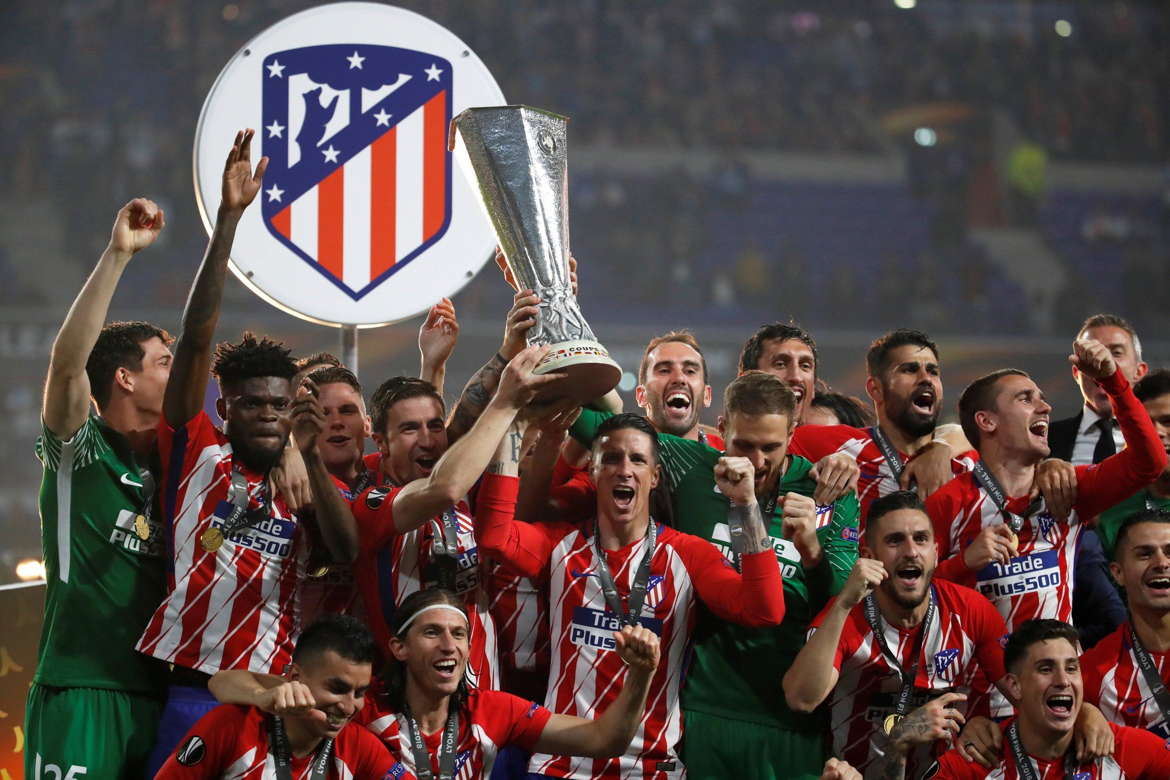 Atletico Madrid's players lift the Europa League trophy