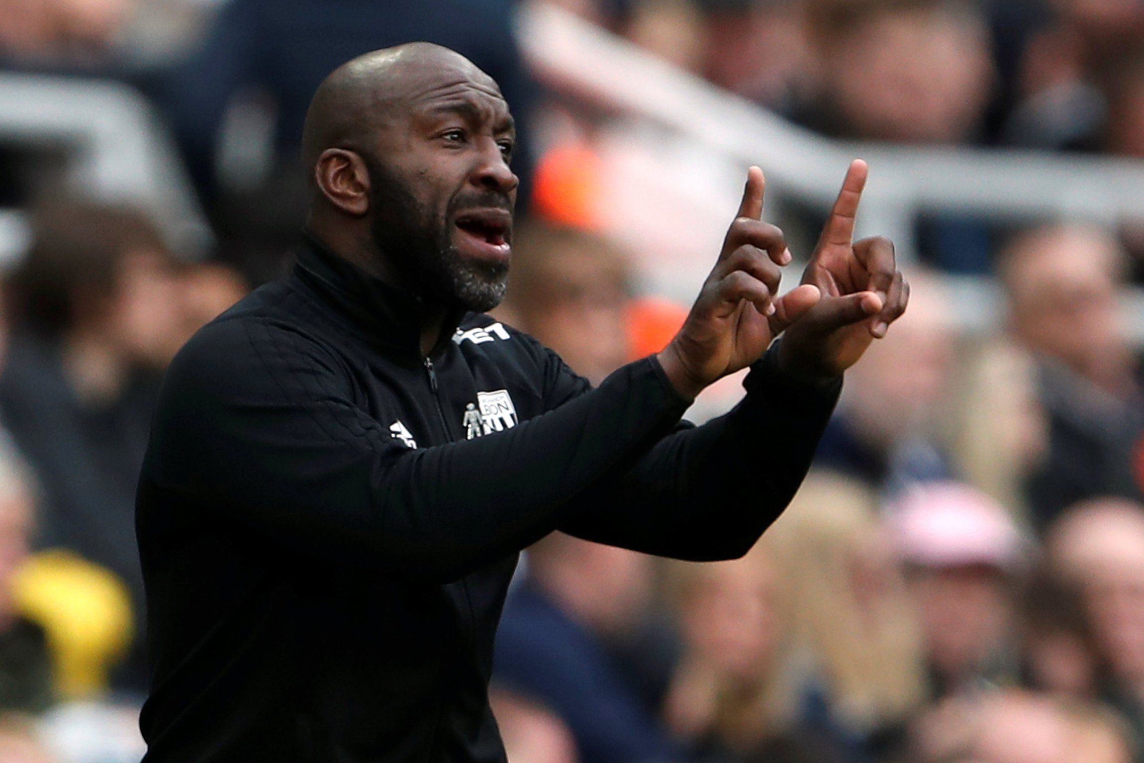 Darren Moore gives instructions from the touchline