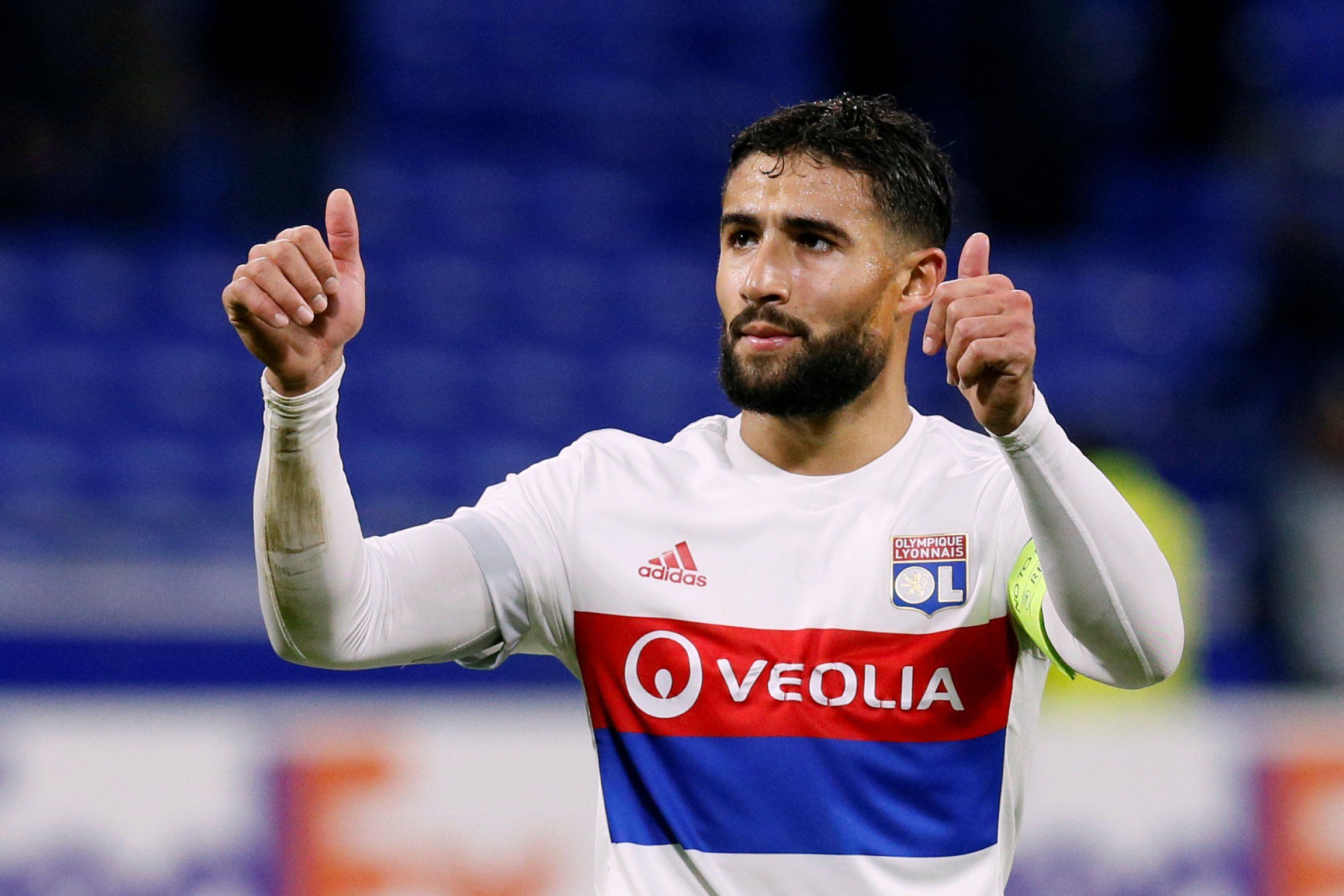 Lyon's Nabil Fekir salutes supporters