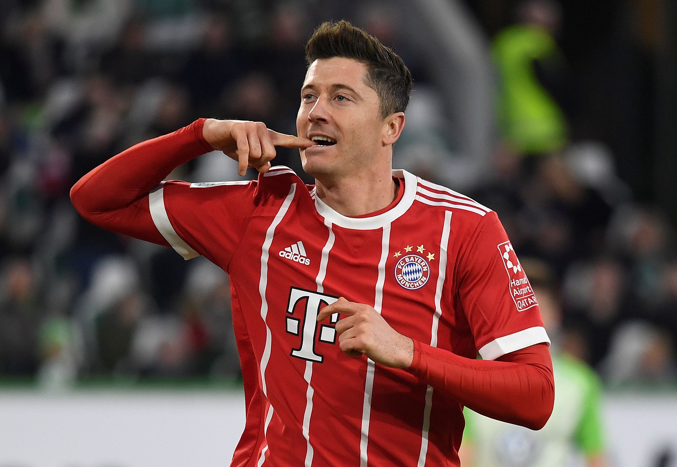 Soccer Football - Bundesliga - VfL Wolfsburg vs Bayern Munich - Volkswagen Arena, Wolfsburg, Germany - February 17, 2018   Bayern Munich's Robert Lewandowski celebrates scoring their second goal    REUTERS/Fabian Bimmer    DFL RULES TO LIMIT THE ONLINE USAGE DURING MATCH TIME TO 15 PICTURES PER GAME. IMAGE SEQUENCES TO SIMULATE VIDEO IS NOT ALLOWED AT ANY TIME. FOR FURTHER QUERIES PLEASE CONTACT DFL DIRECTLY AT + 49 69 650050
