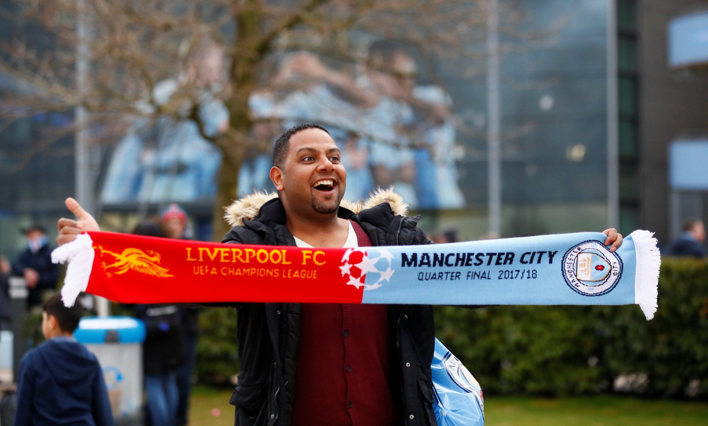 Fan with half and half scarf before Liverpool v Man City Champions League quarter final