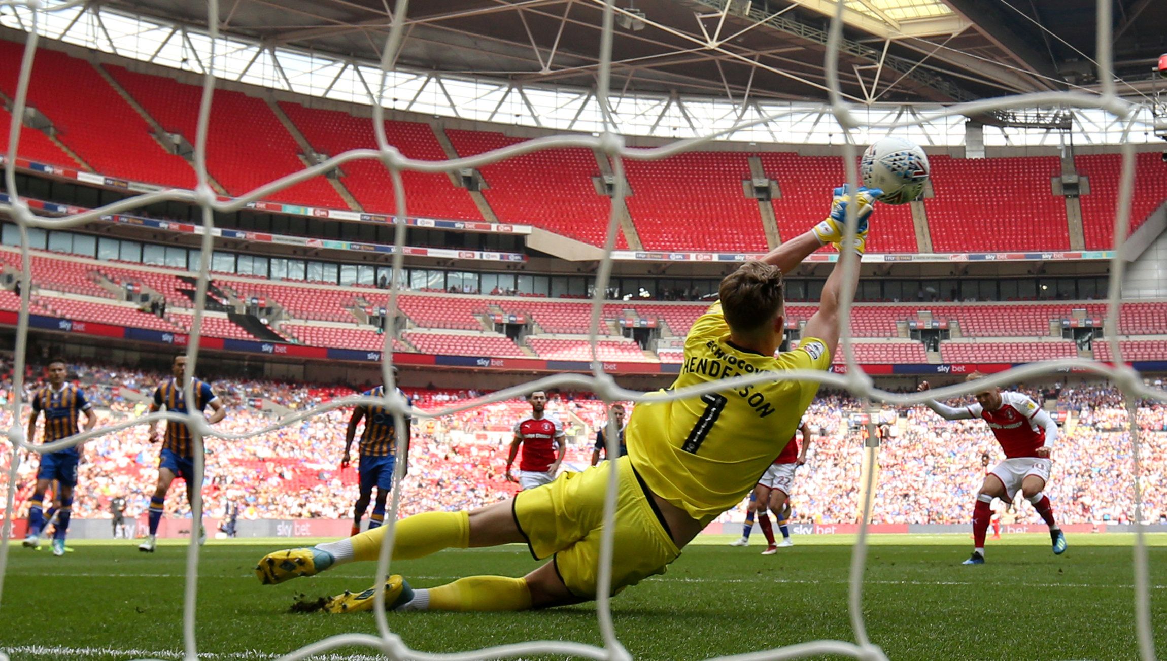 Dean Henderson saves a penalty at Wembley