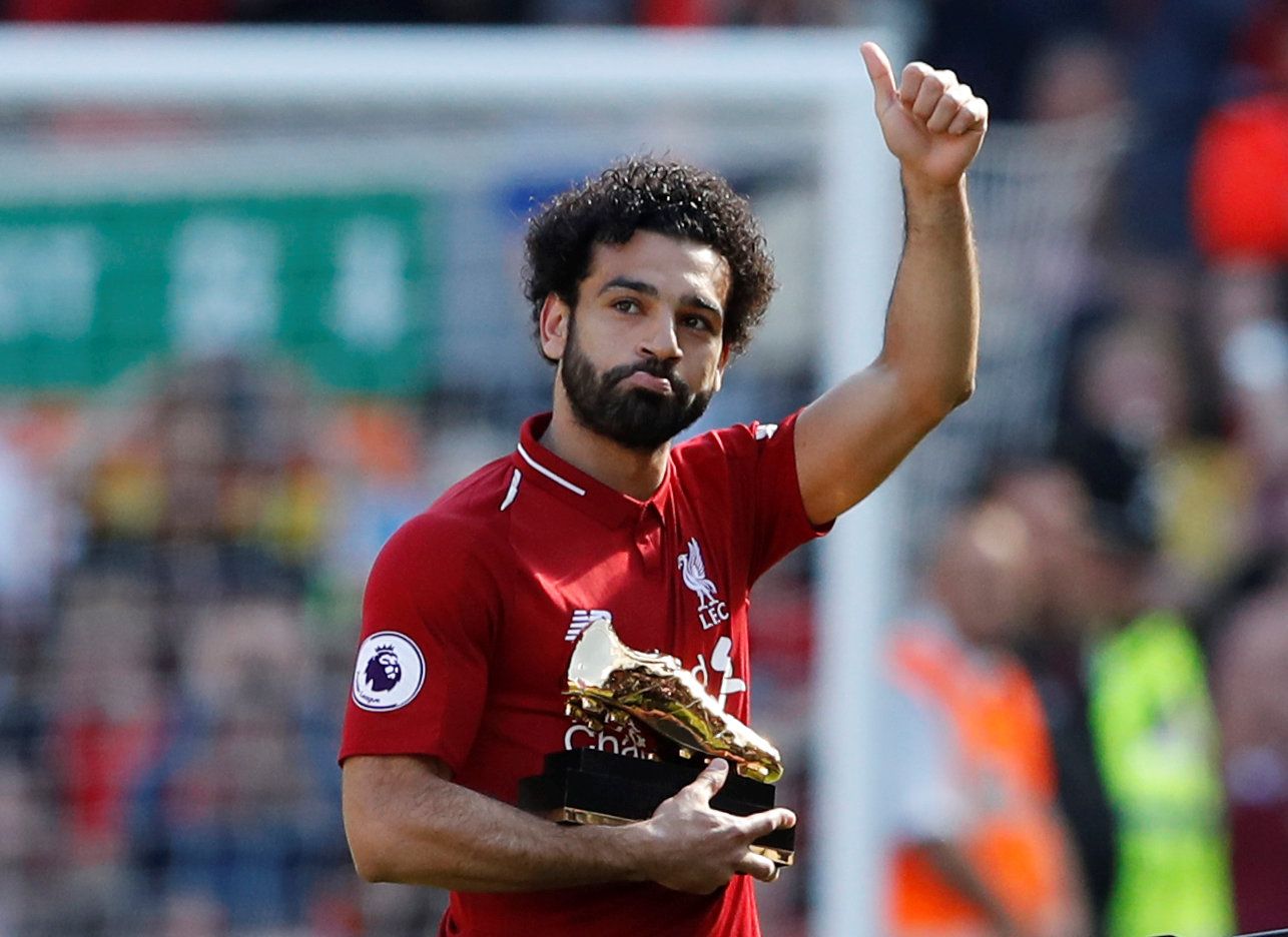 Soccer Football - Premier League - Liverpool vs Brighton &amp; Hove Albion - Anfield, Liverpool, Britain - May 13, 2018   Liverpool's Mohamed Salah celebrates with the Golden Boot after the match   Action Images via Reuters/Carl Recine    EDITORIAL USE ONLY. No use with unauthorized audio, video, data, fixture lists, club/league logos or "live" services. Online in-match use limited to 75 images, no video emulation. No use in betting, games or single club/league/player publications.  Please conta