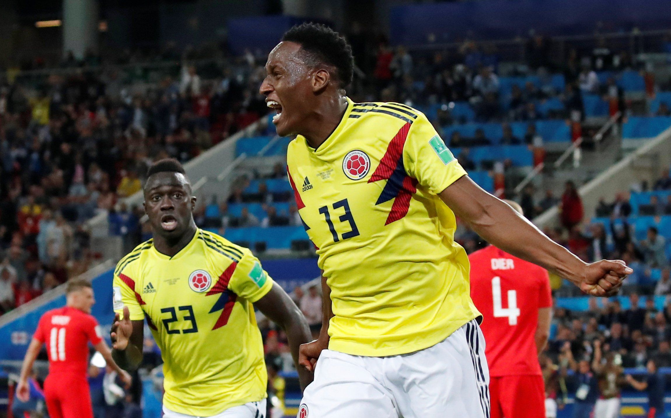 Barcelona's Yerry Mina celebrates scoring for Colombia