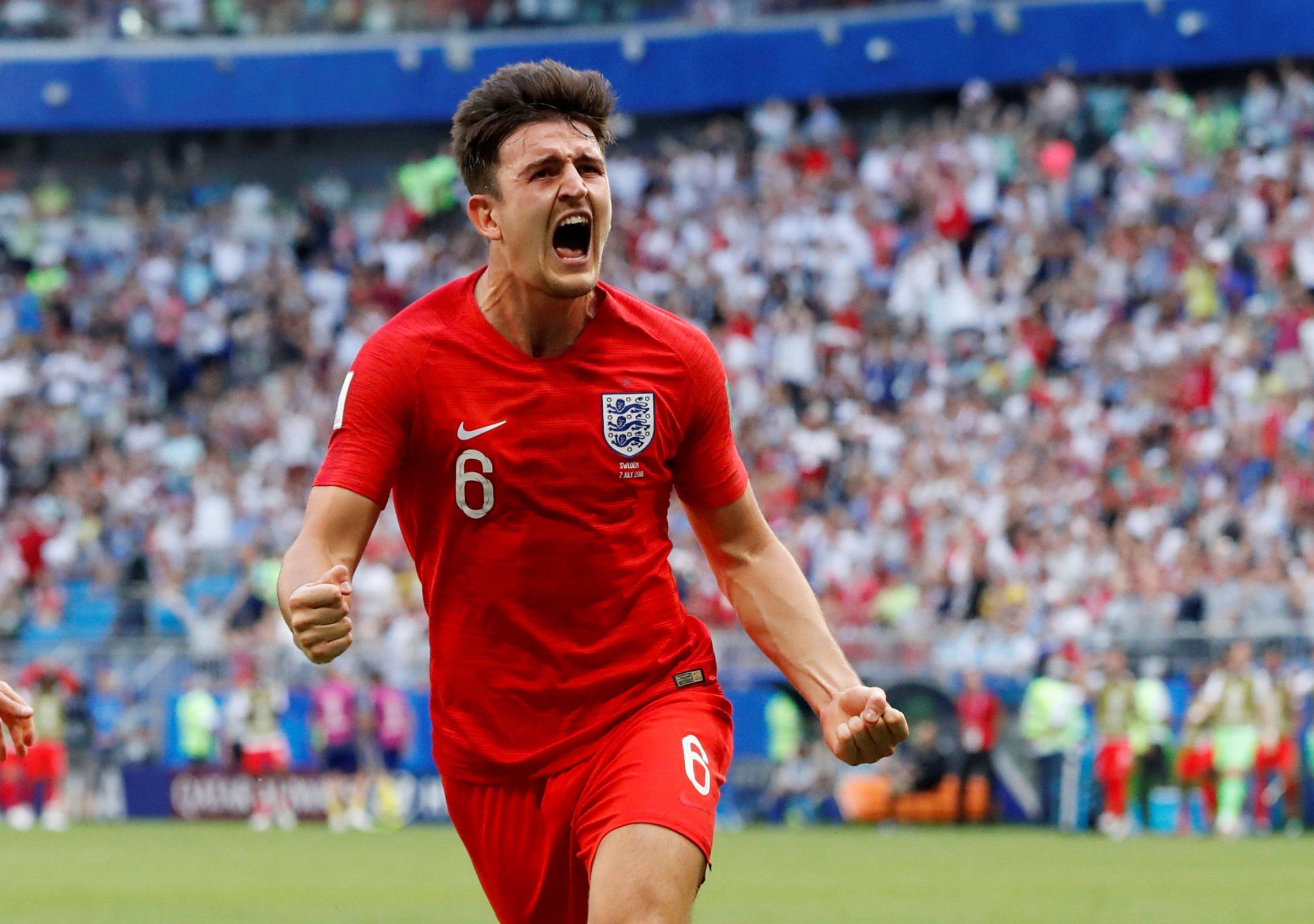 Harry Maguire celebrates scoring for England against Sweden at the World Cup