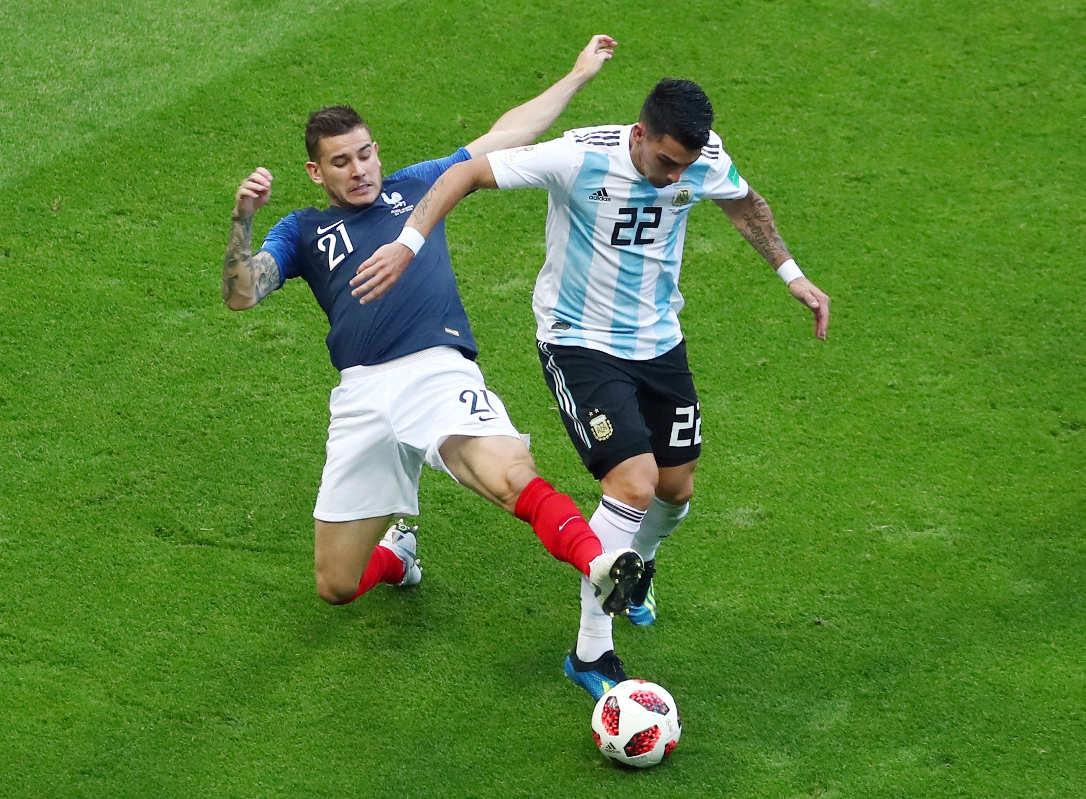 Soccer Football - World Cup - Round of 16 - France vs Argentina - Kazan Arena, Kazan, Russia - June 30, 2018  Argentina's Cristian Pavon in action with France's Lucas Hernandez   REUTERS/Pilar Olivares