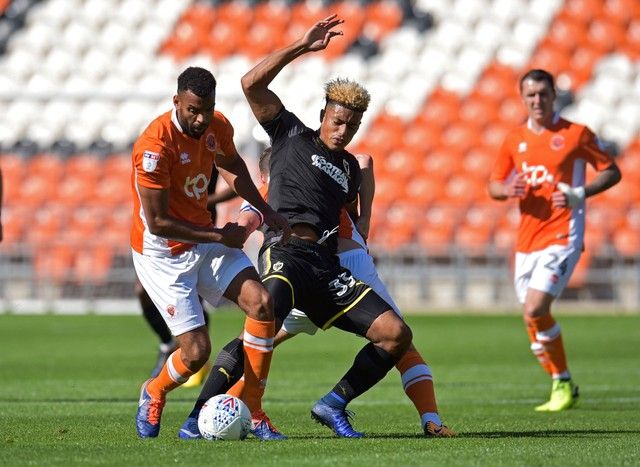Soccer Football - League One - Blackpool vs AFC Wimbledon - Blackpool, Britain - September 2, 2017   AFC Wimbledon's Lyle Taylor in action with Blackpool's Curtis Tilt   Action Images/Paul Burrows    EDITORIAL USE ONLY. No use with unauthorized audio, video, data, fixture lists, club/league logos or 