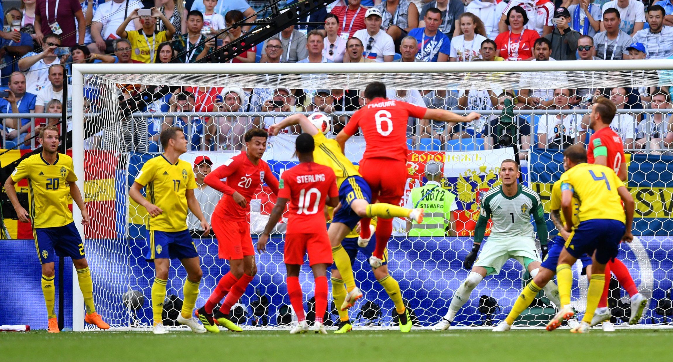 Harry Maguire heads home from a corner against Sweden
