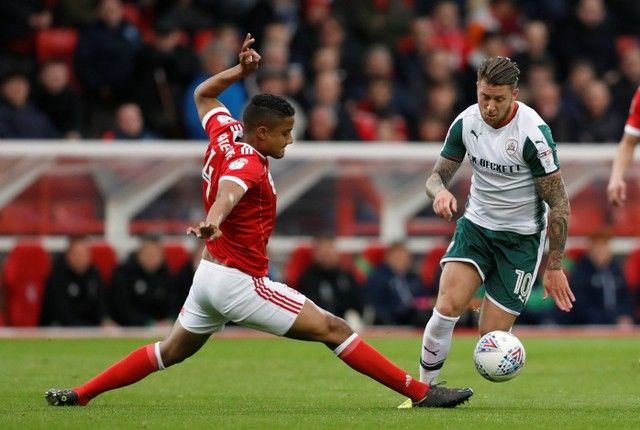 Soccer Football - Championship - Nottingham Forest v Barnsley - The City Ground, Nottingham, Britain - April 24, 2018  Nottingham Forest's Michael Mancienne in action with Barnsley's George Moncur   Action Images/Matthew Childs  EDITORIAL USE ONLY. No use with unauthorized audio, video, data, fixture lists, club/league logos or 