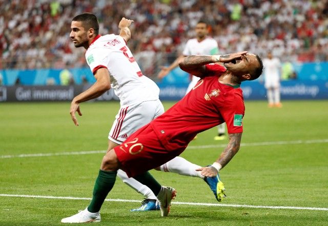 Soccer Football - World Cup - Group B - Iran vs Portugal - Mordovia Arena, Saransk, Russia - June 25, 2018   Iran's Milad Mohammadi as Portugal's Ricardo Quaresma reacts after sustaining an injury    REUTERS/Murad Sezer