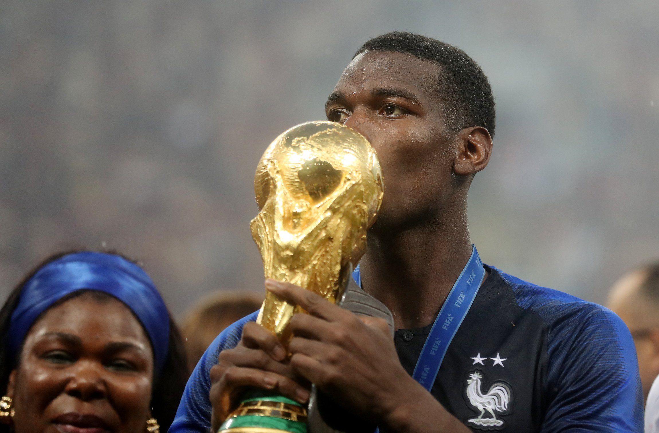 Paul Pogba kissing the World Cup trophy