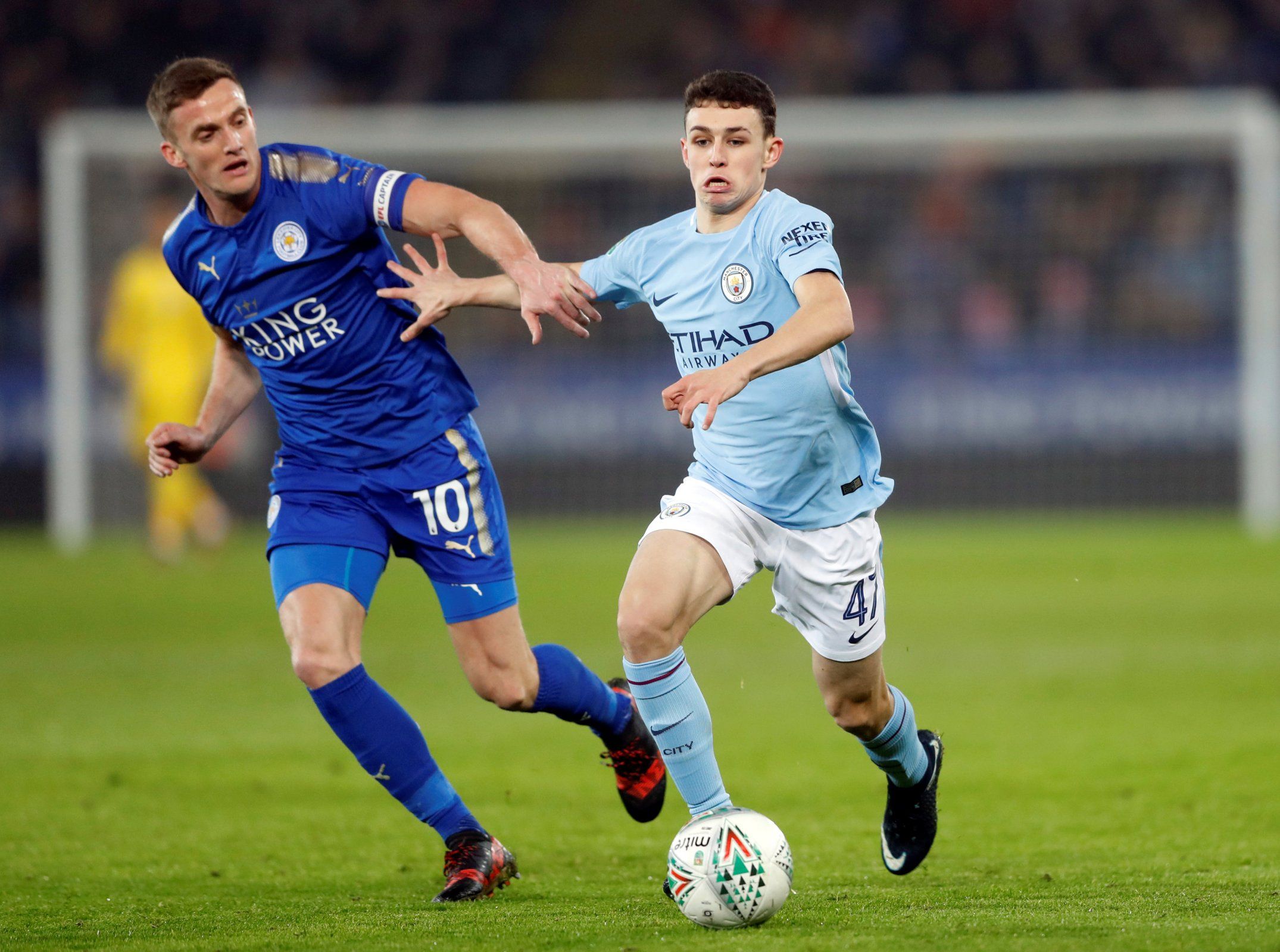 Phil Foden shrugs off a challenge from Andy King