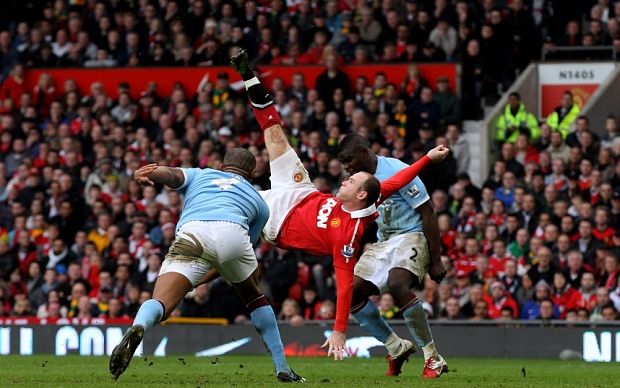Manchester United v Manchester City - Premier League...MANCHESTER, ENGLAND - FEBRUARY 12:  Wayne Rooney of Manchester United scores a goal from an overhead kick during the Barclays Premier League match between Manchester United and Manchester City at Old Trafford on February 12, 2011 in Manchester, England.  (Photo by Alex Livesey/Getty Images) *** Local Caption *** Wayne Rooney