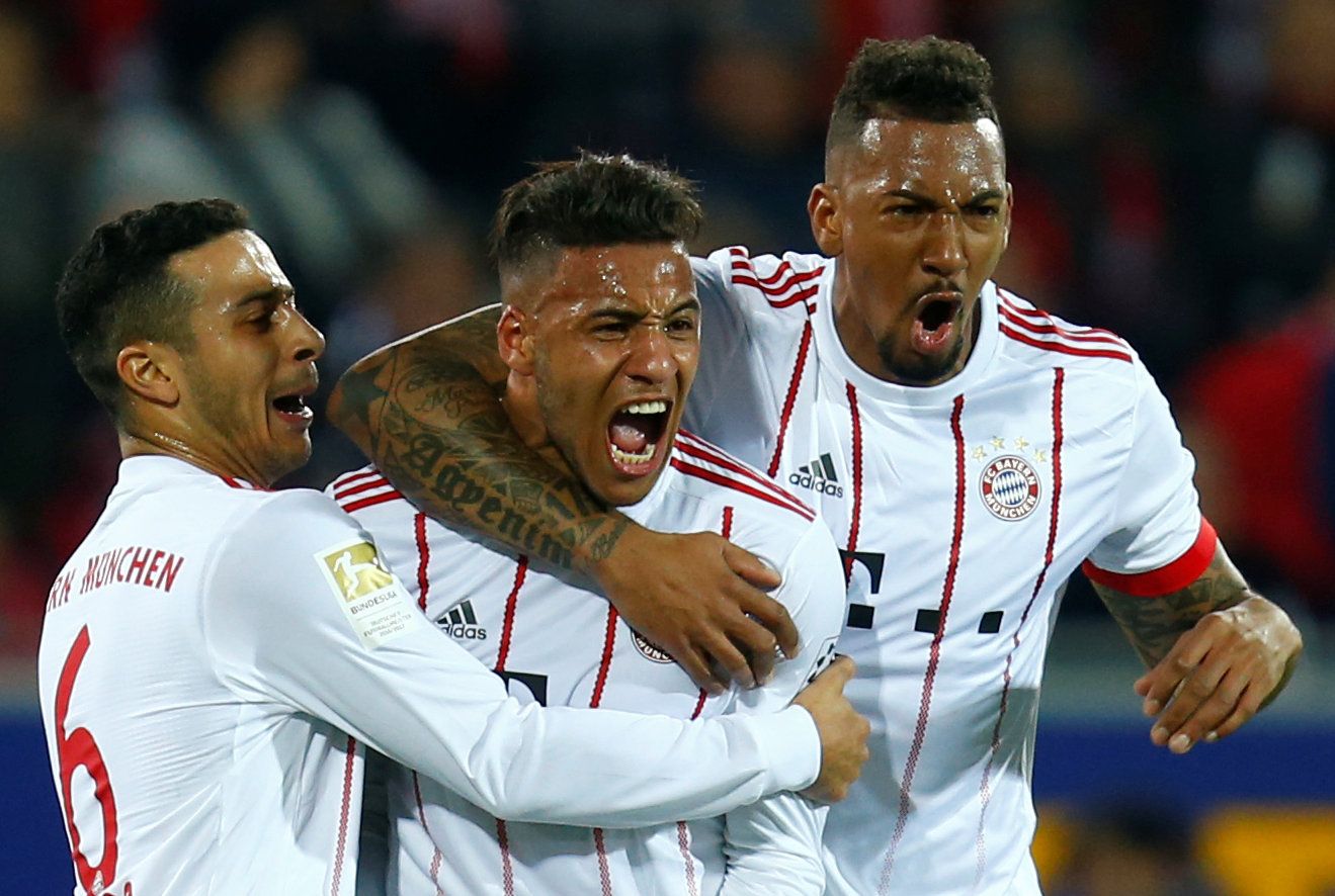 Soccer Football - Bundesliga - SC Freiburg vs Bayern Munich - Schwarzwald-Stadion, Freiburg, Germany - March 4, 2018   Bayern Munich's Corentin Tolisso celebrates scoring their second goal with Thiago Alcantara and Jerome Boateng            REUTERS/Ralph Orlowski    DFL RULES TO LIMIT THE ONLINE USAGE DURING MATCH TIME TO 15 PICTURES PER GAME. IMAGE SEQUENCES TO SIMULATE VIDEO IS NOT ALLOWED AT ANY TIME. FOR FURTHER QUERIES PLEASE CONTACT DFL DIRECTLY AT + 49 69 650050