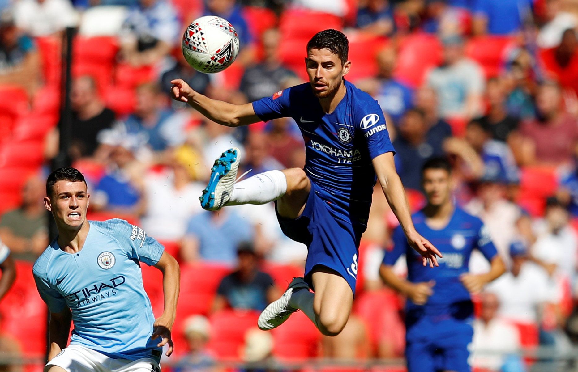Chelsea's Jorginho challenges Man City's Phil Foden for the ball at the Community Shield